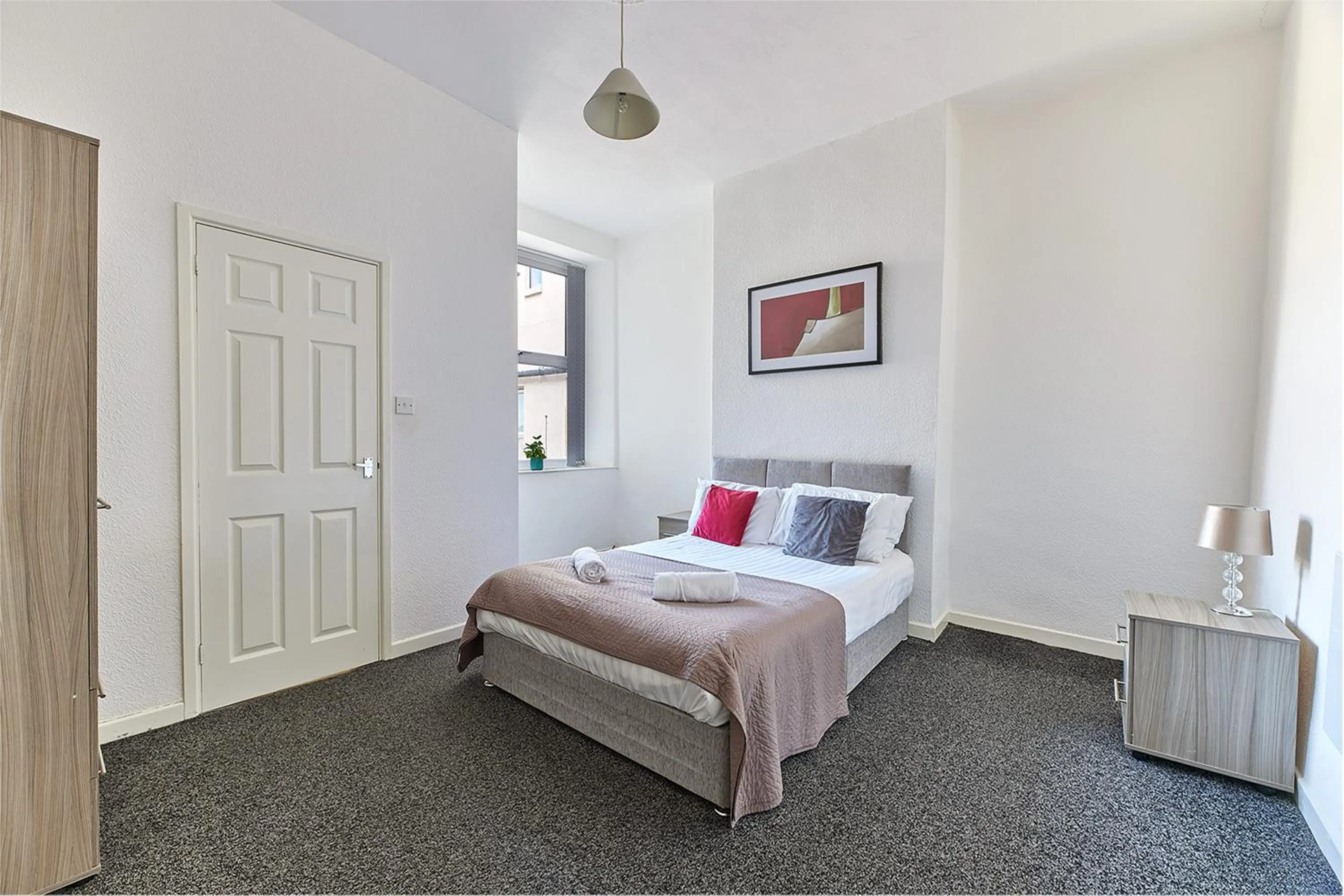 Bed in Pleasure Holiday Apartments