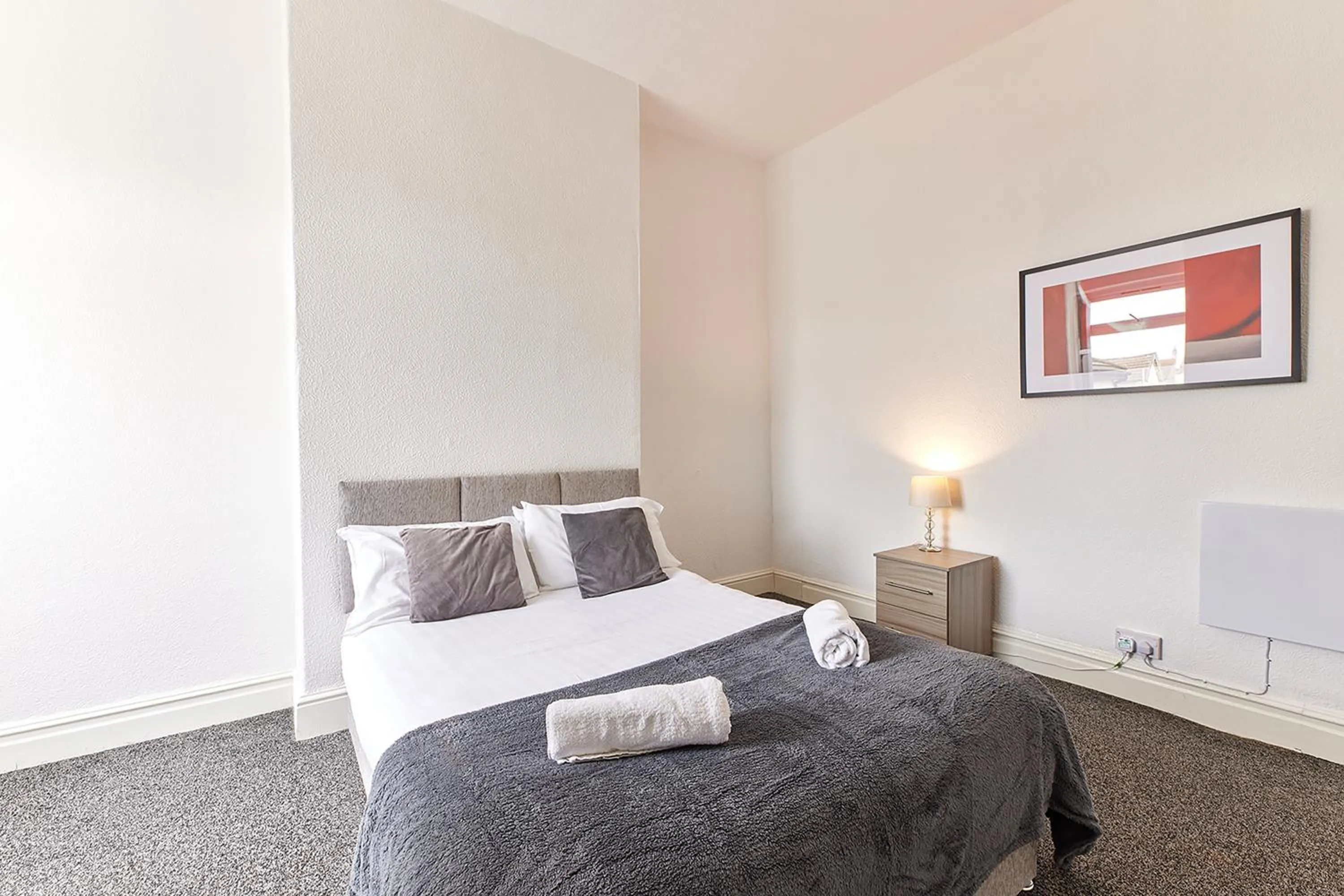 Bed in Pleasure Holiday Apartments