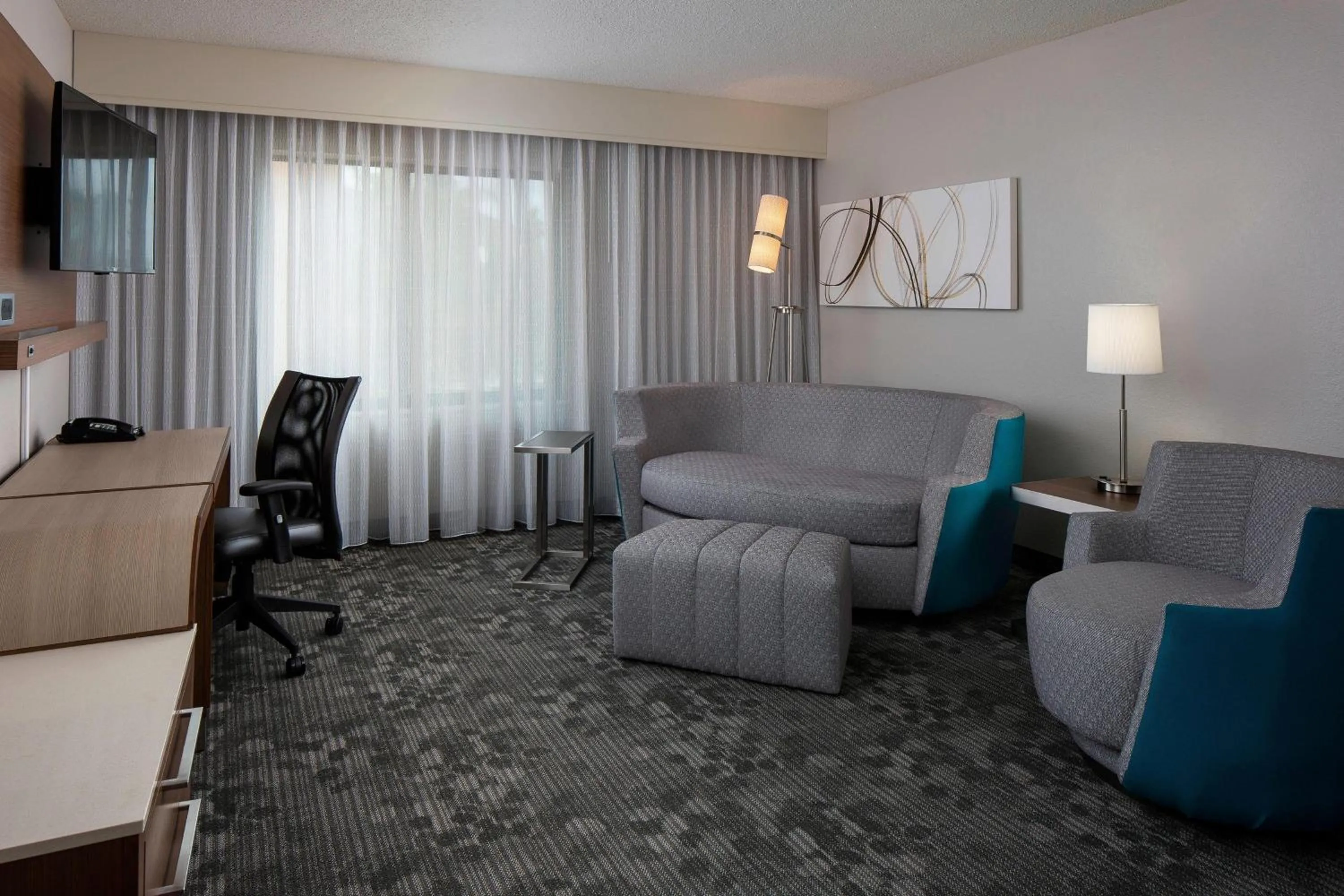 Living room in Courtyard by Marriott Daytona Beach Speedway/Airport