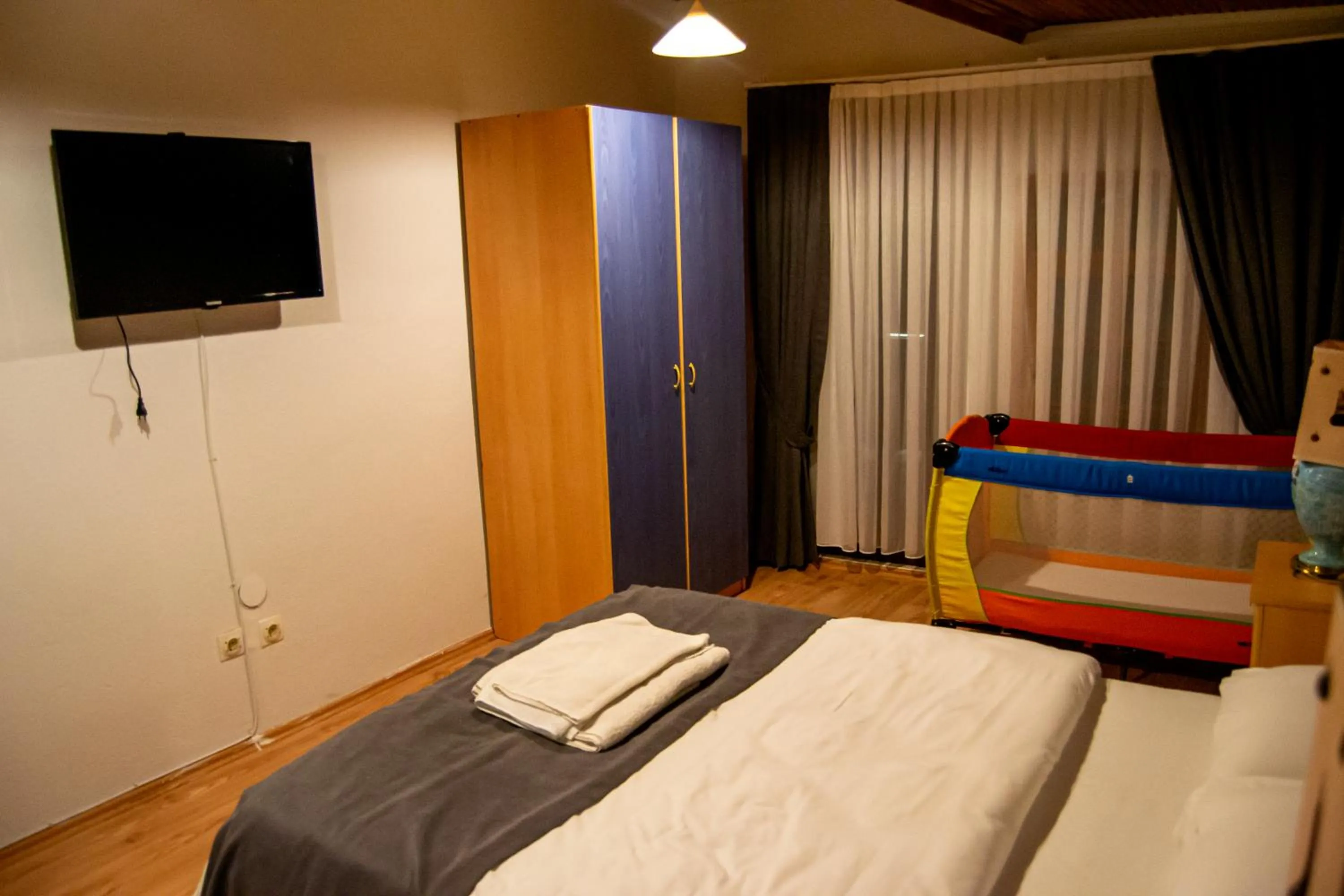 Communal lounge/ TV room, Bed in Kaltur Boutique Hotel