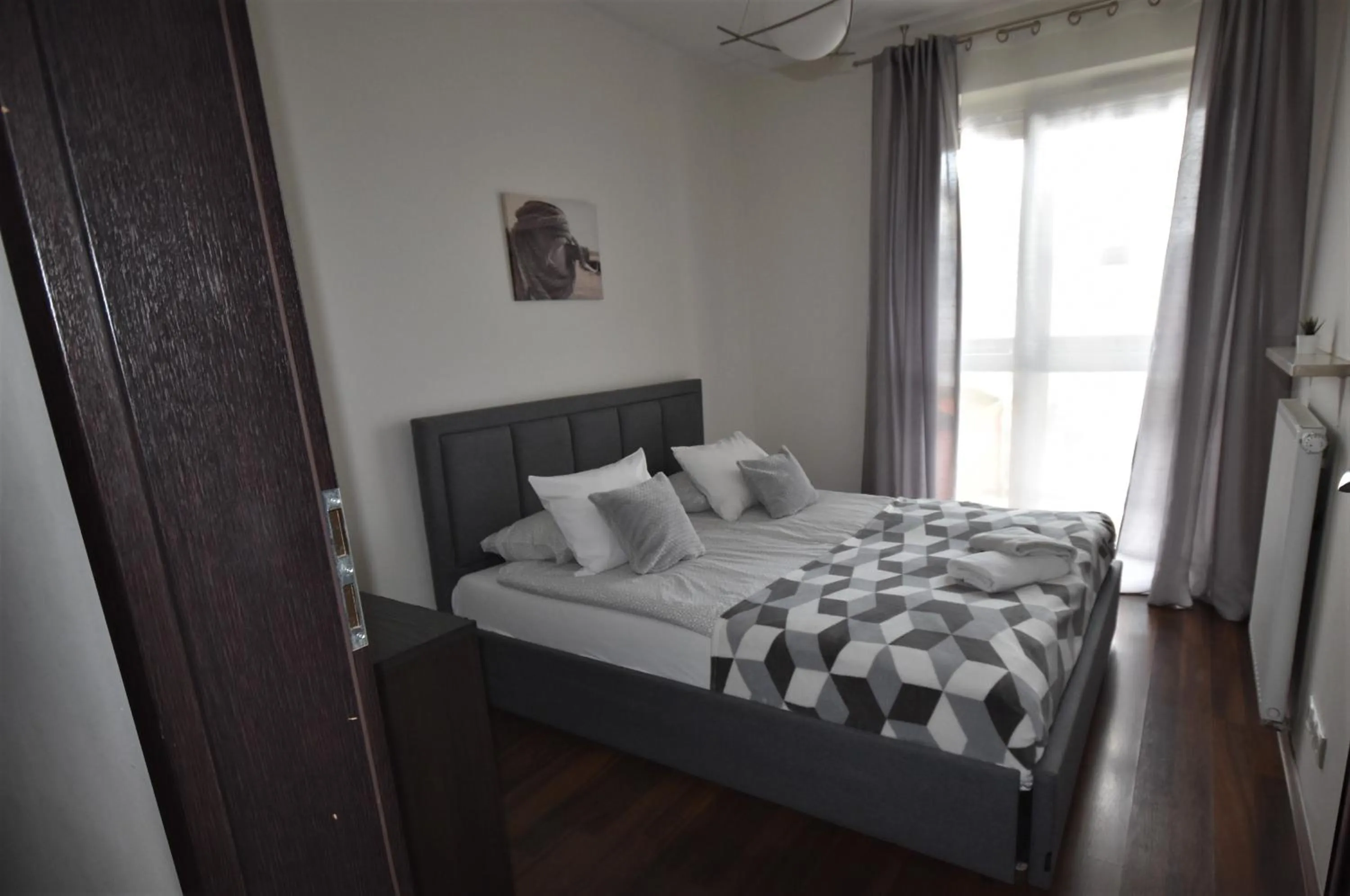 Bed in Senator Warsaw Apartments