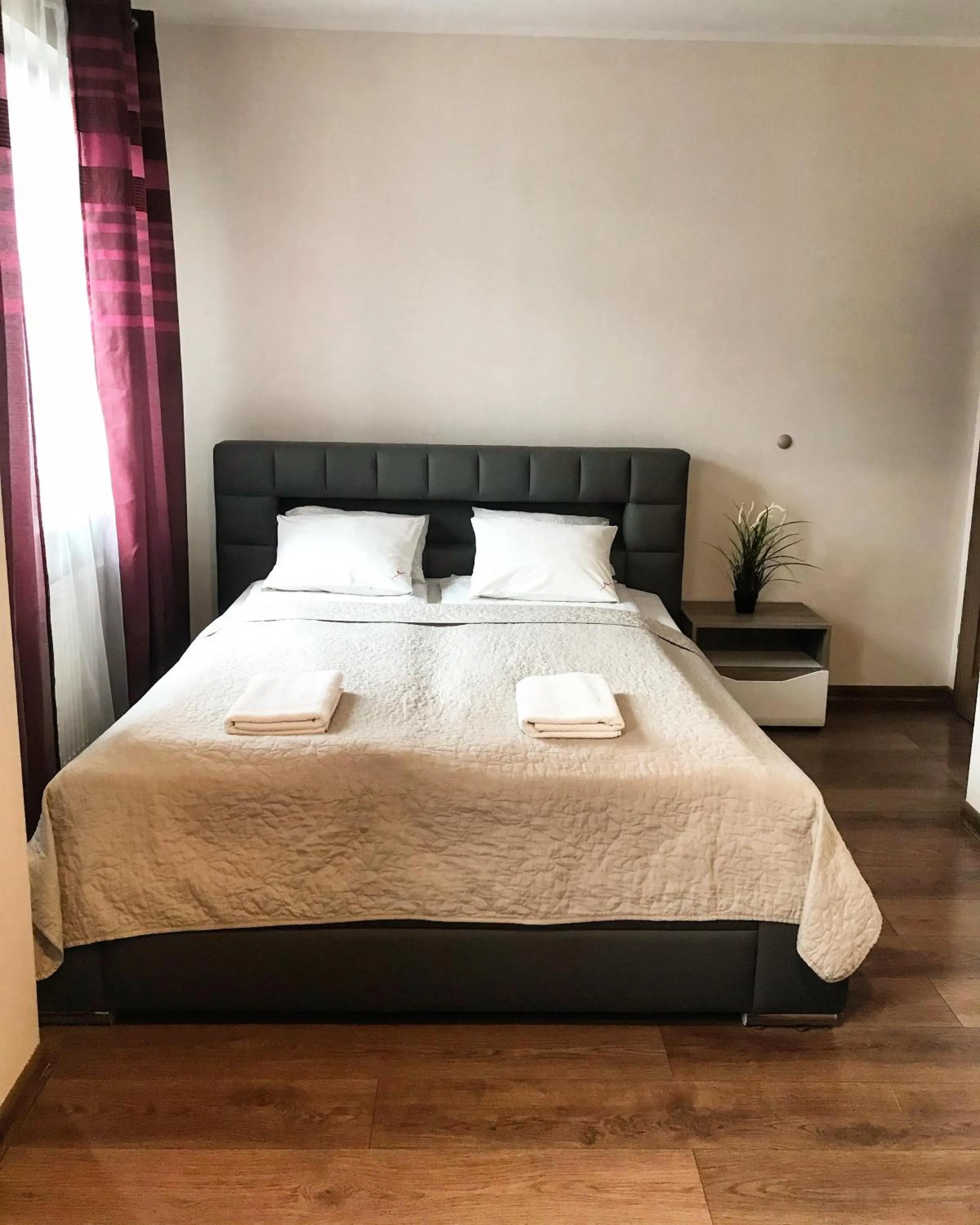 Bed in Senator Warsaw Apartments