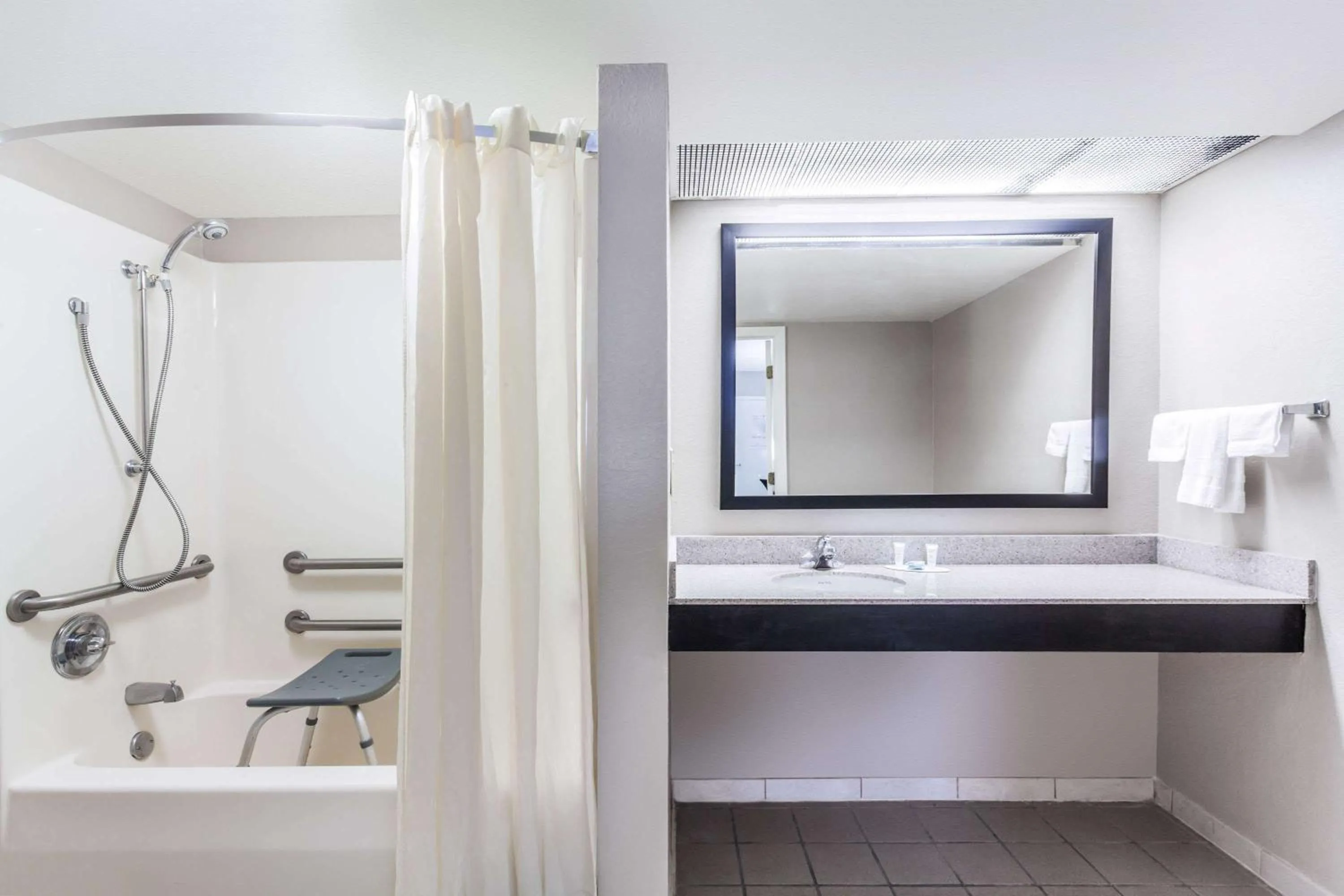 Bathroom in Super 8 by Wyndham Pigeon Forge-Emert St