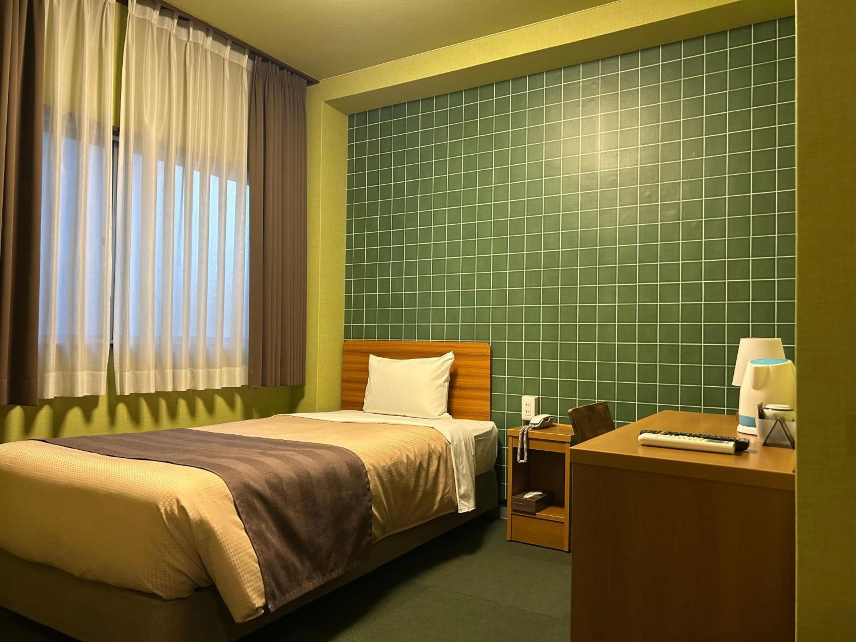 Bed in Tokyo Ueno New Izu Hotel