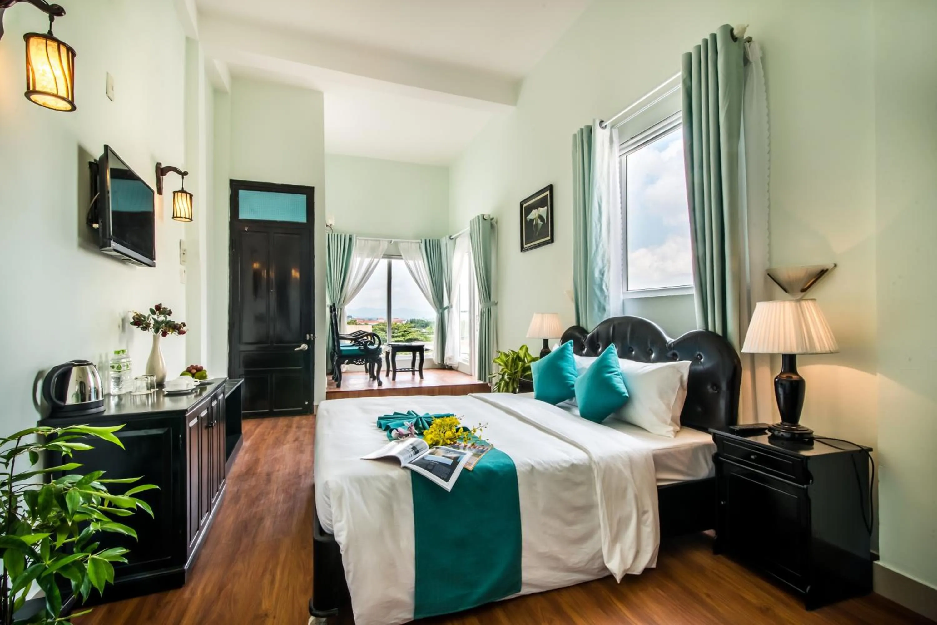 Seating area, Bed in The Sunriver Boutique Hotel Hue
