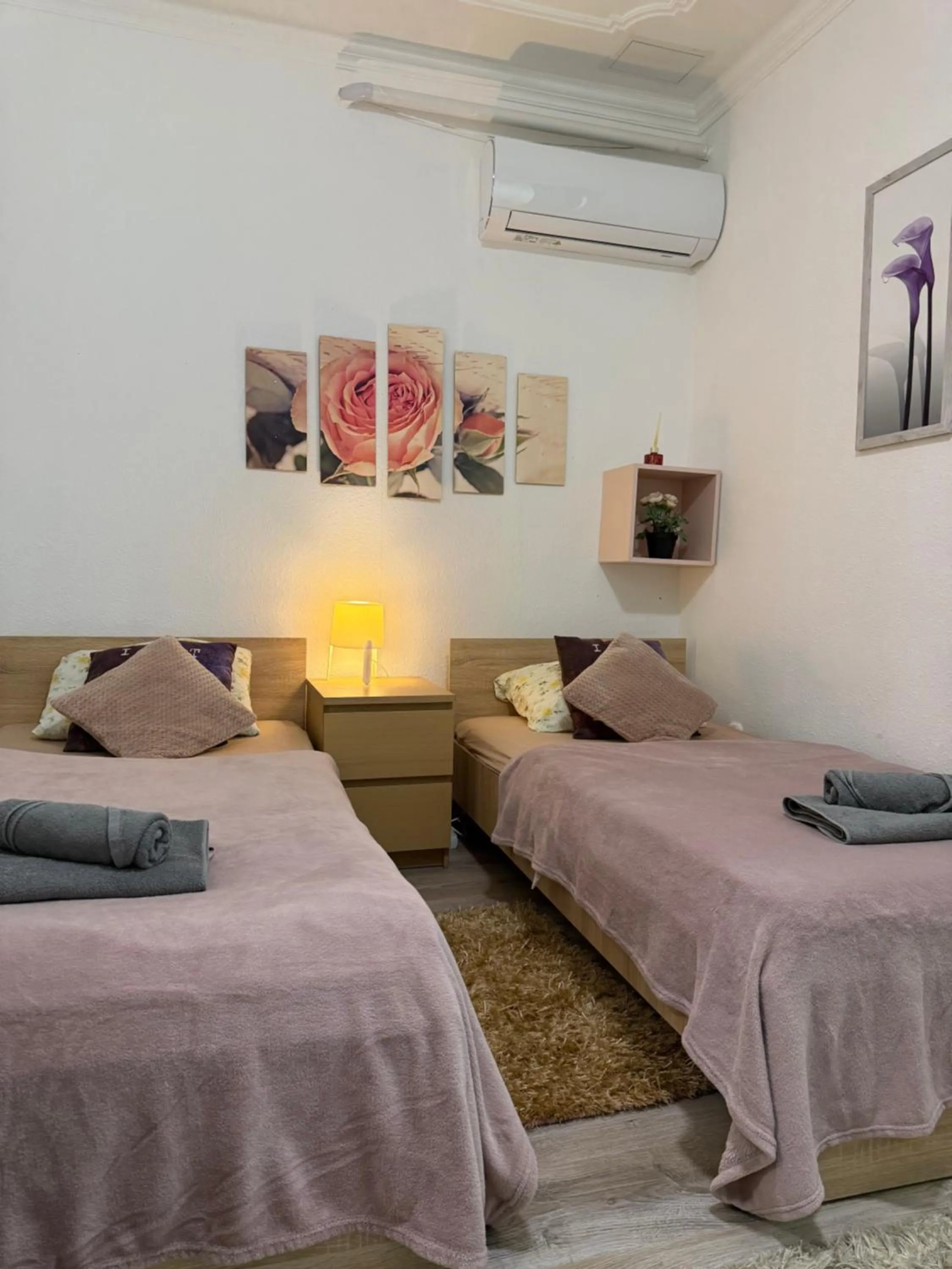 Bed in Le Rose Suites & Park Hotel