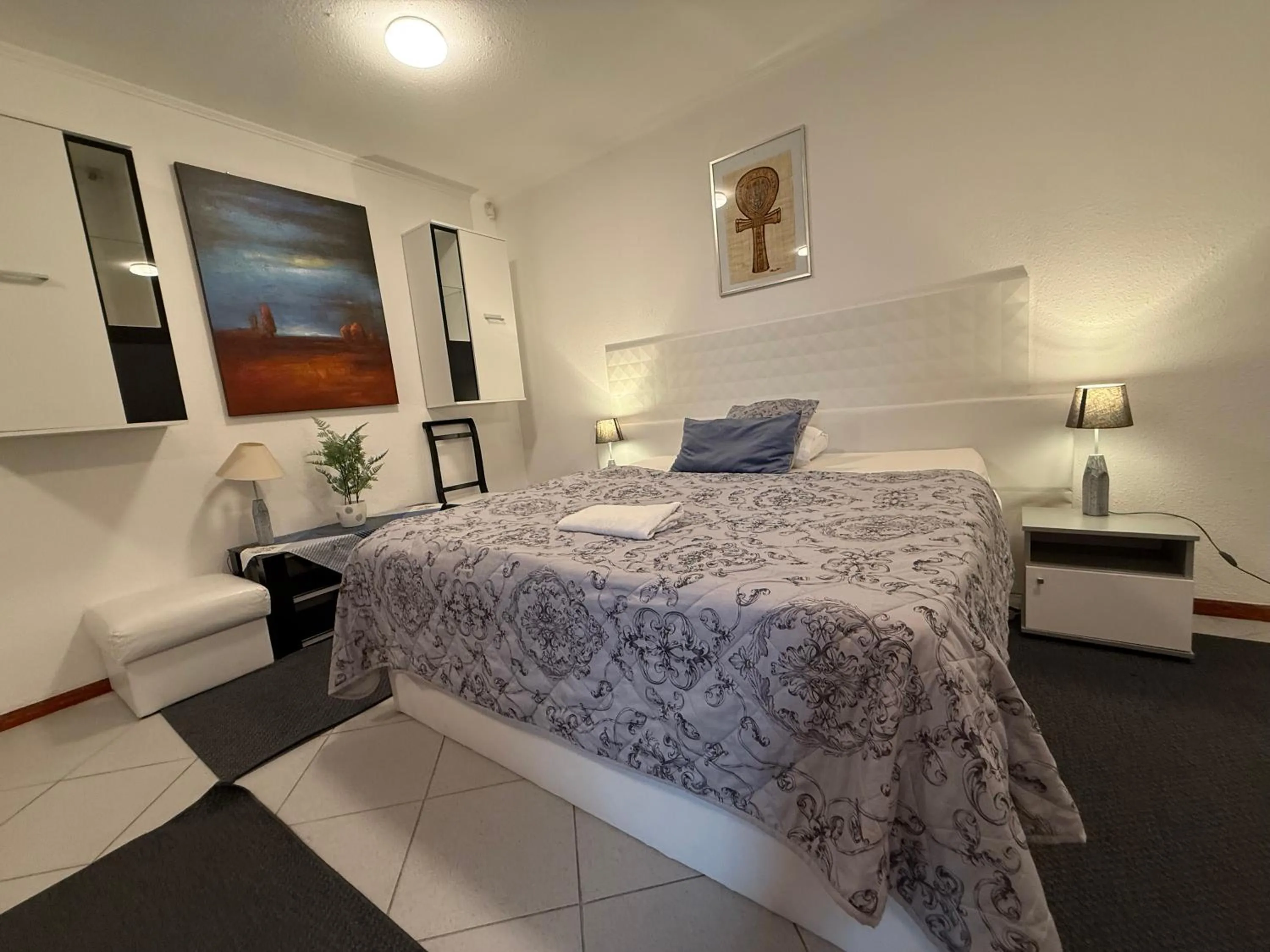 Bed in Le Rose Suites & Park Hotel