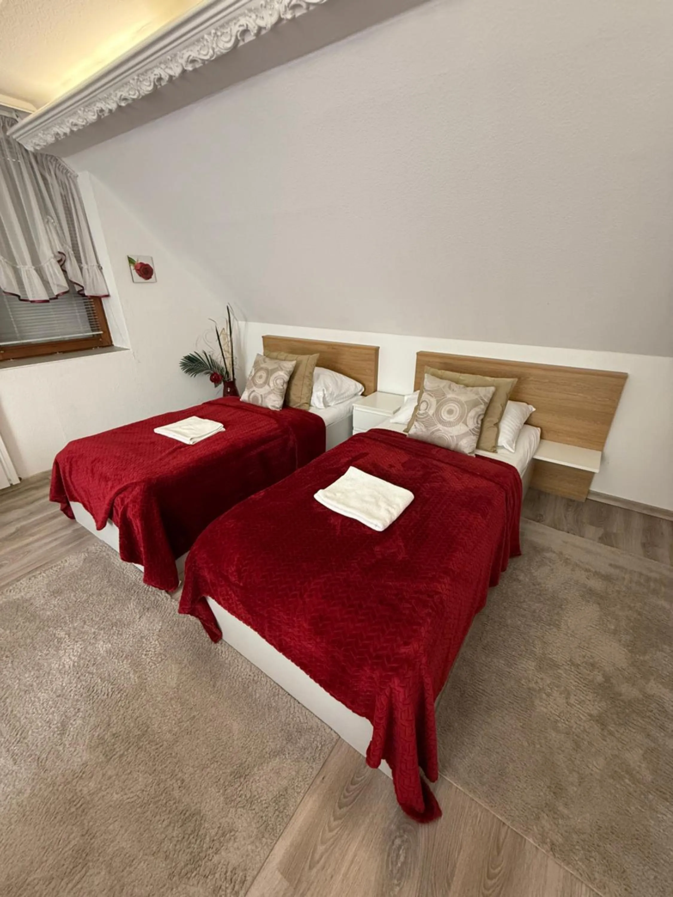 Bed in Le Rose Suites & Park Hotel