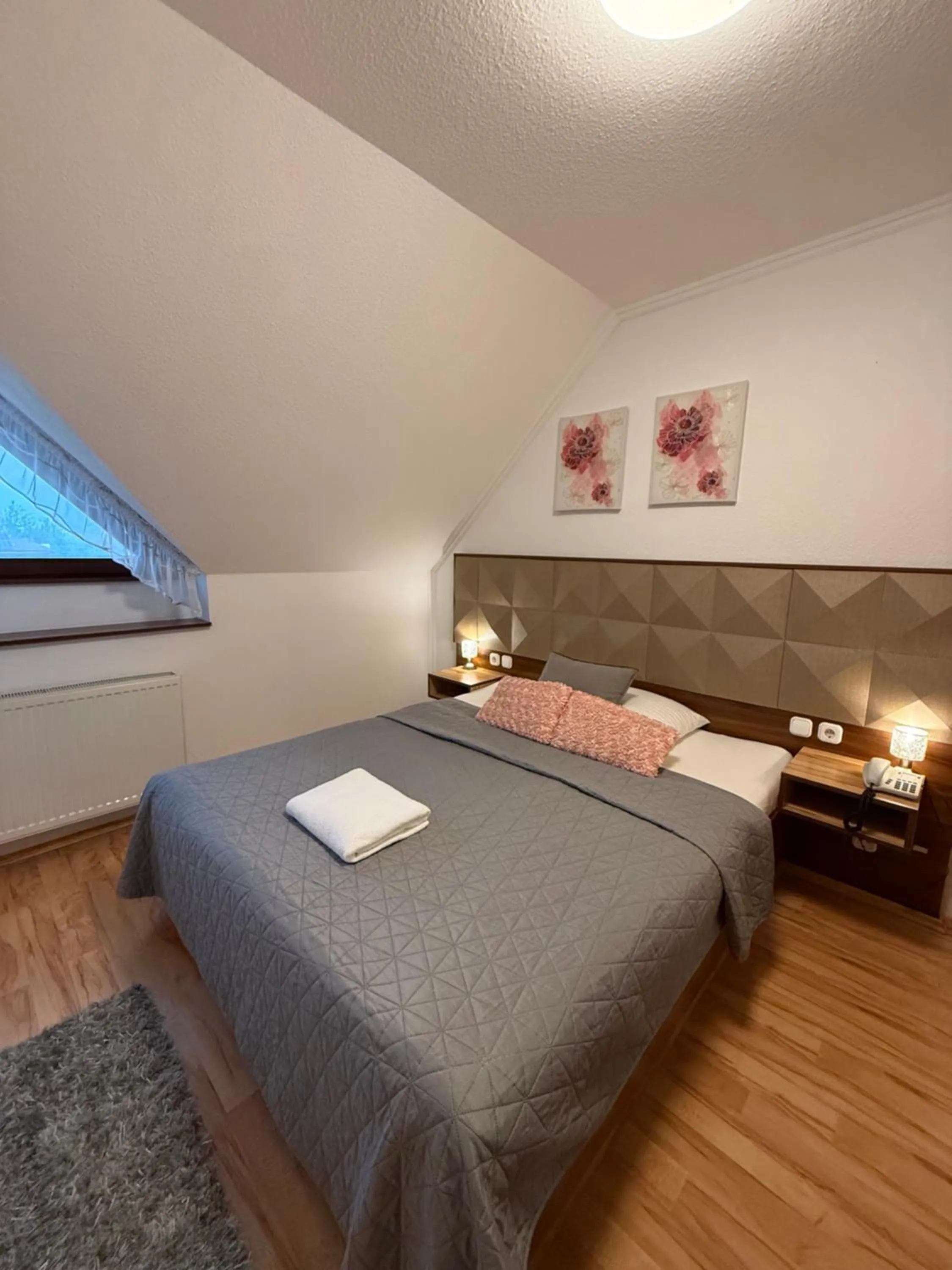 Bed in Le Rose Suites & Park Hotel