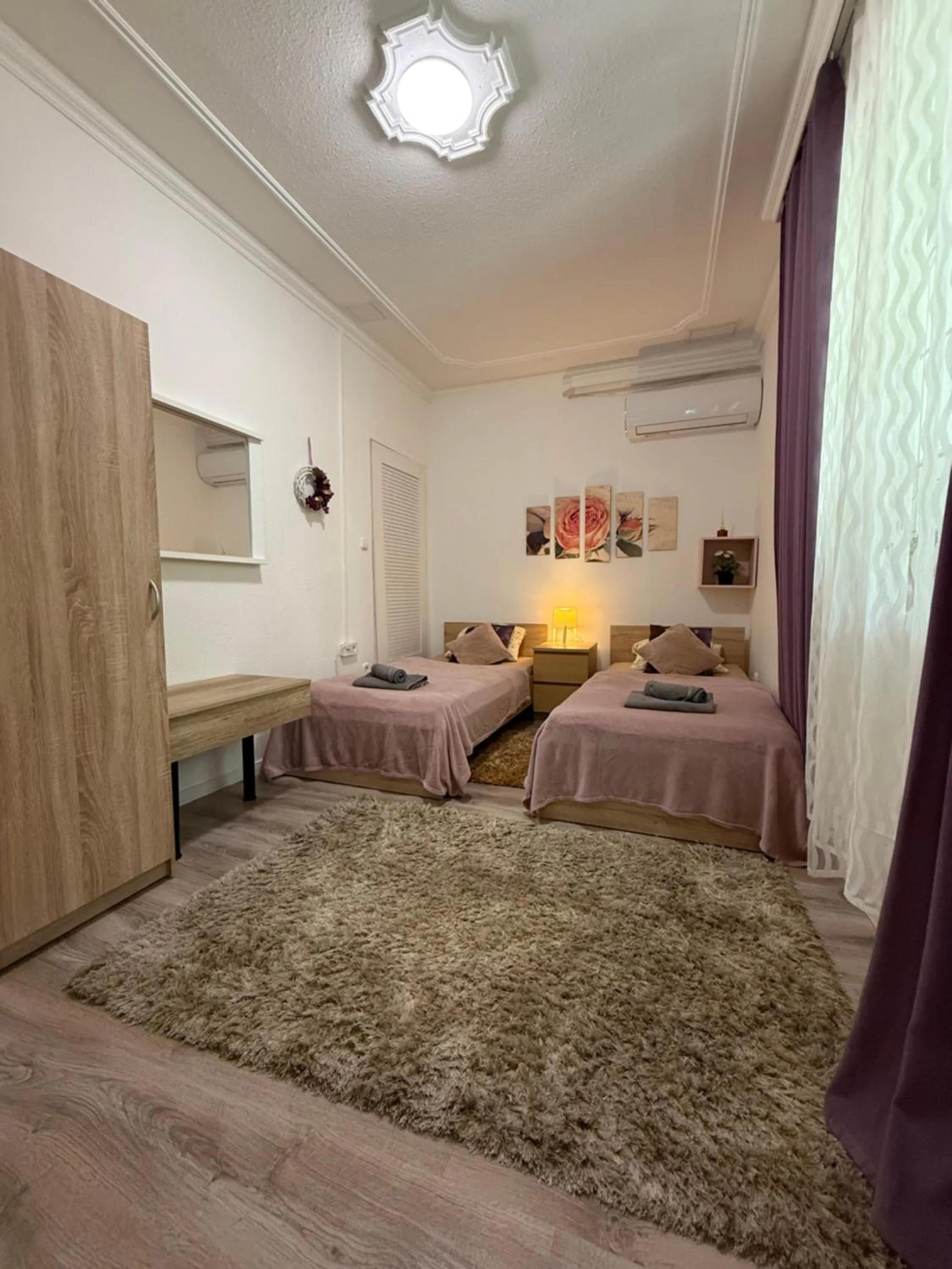 Bed in Le Rose Suites & Park Hotel