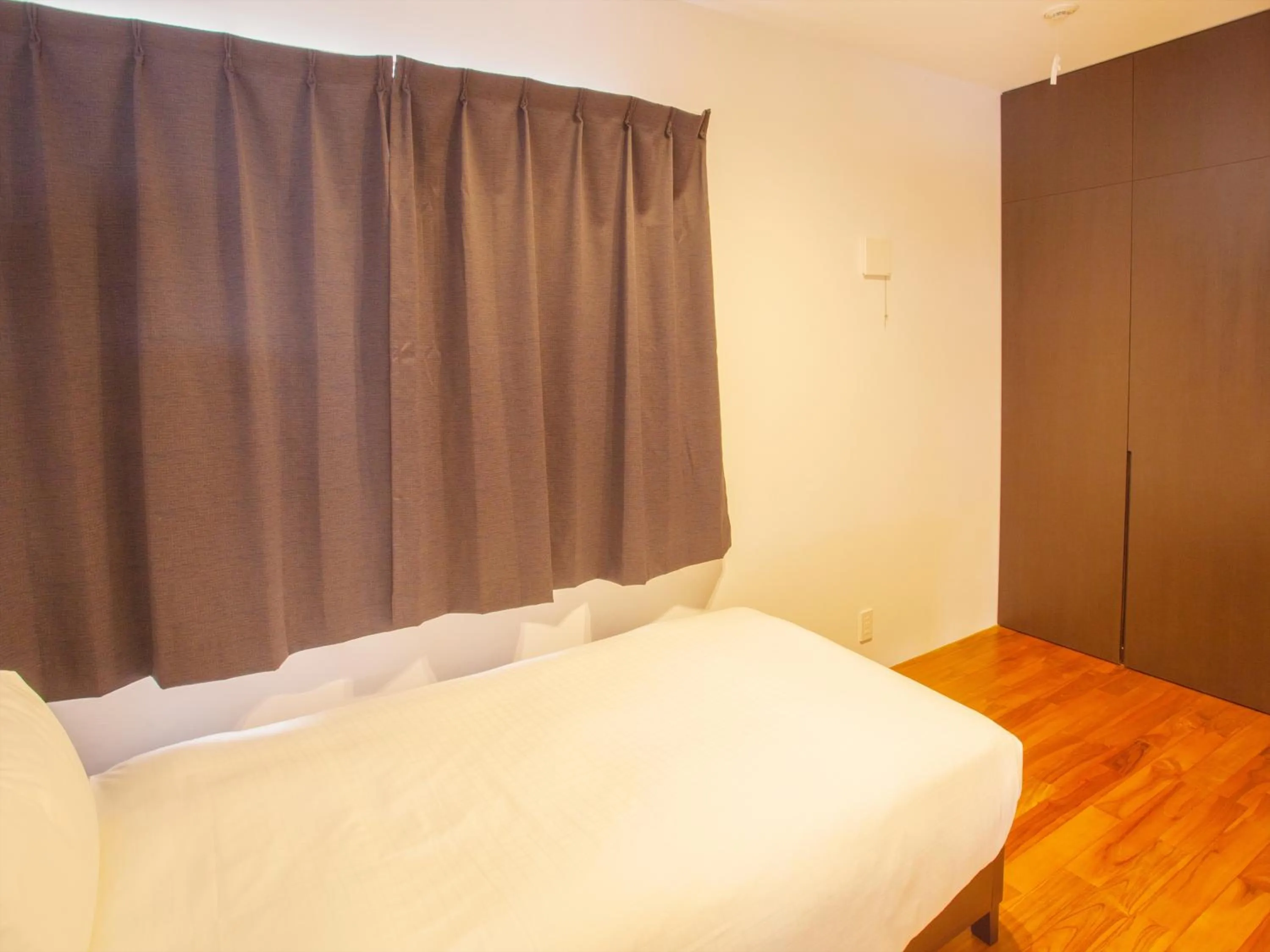 Bedroom, Bed in Kariyushi Condominium Resort Onna Maeda Base