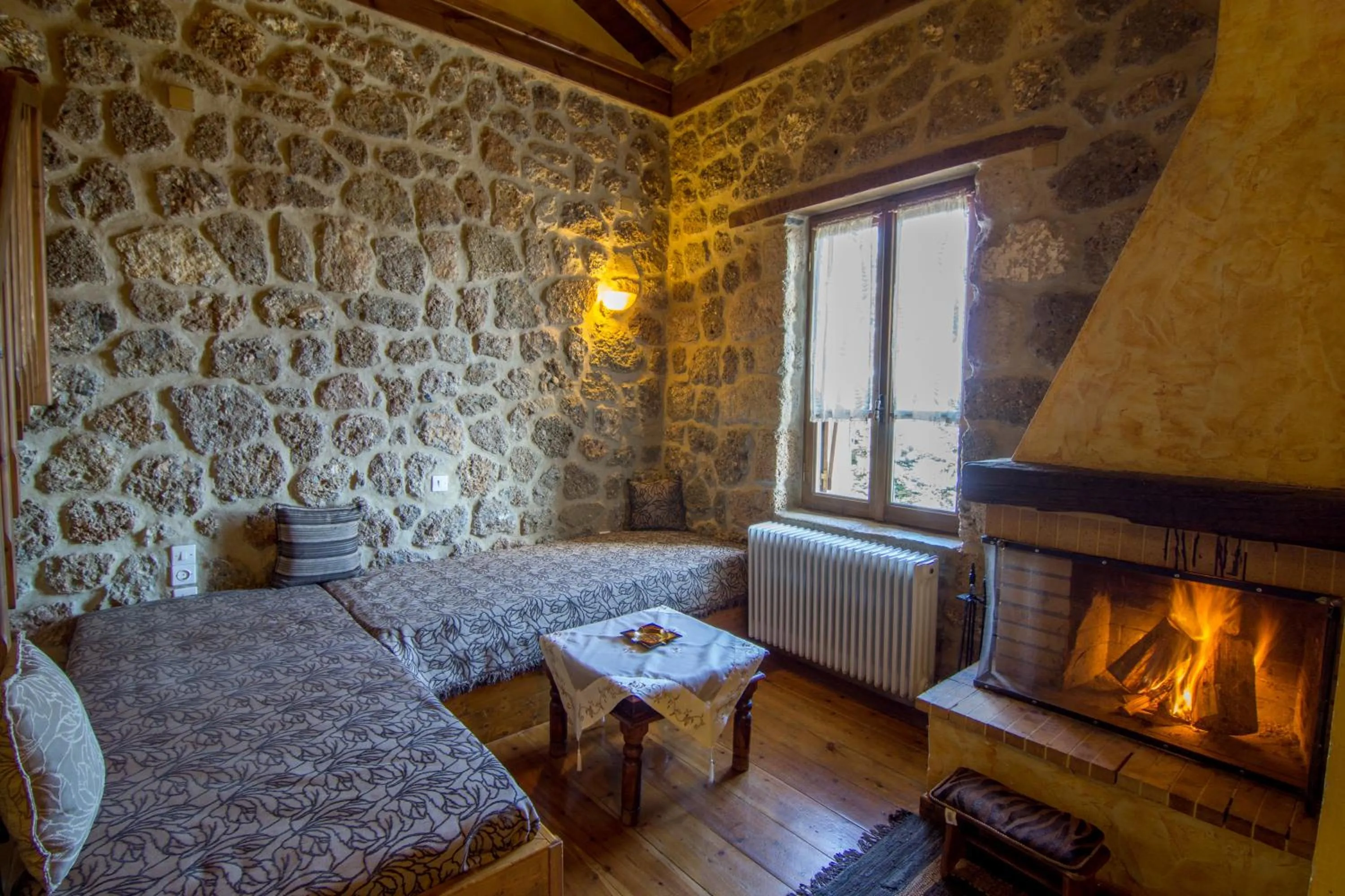 Seating area, Bed in Pigi Tarlampa Hotel