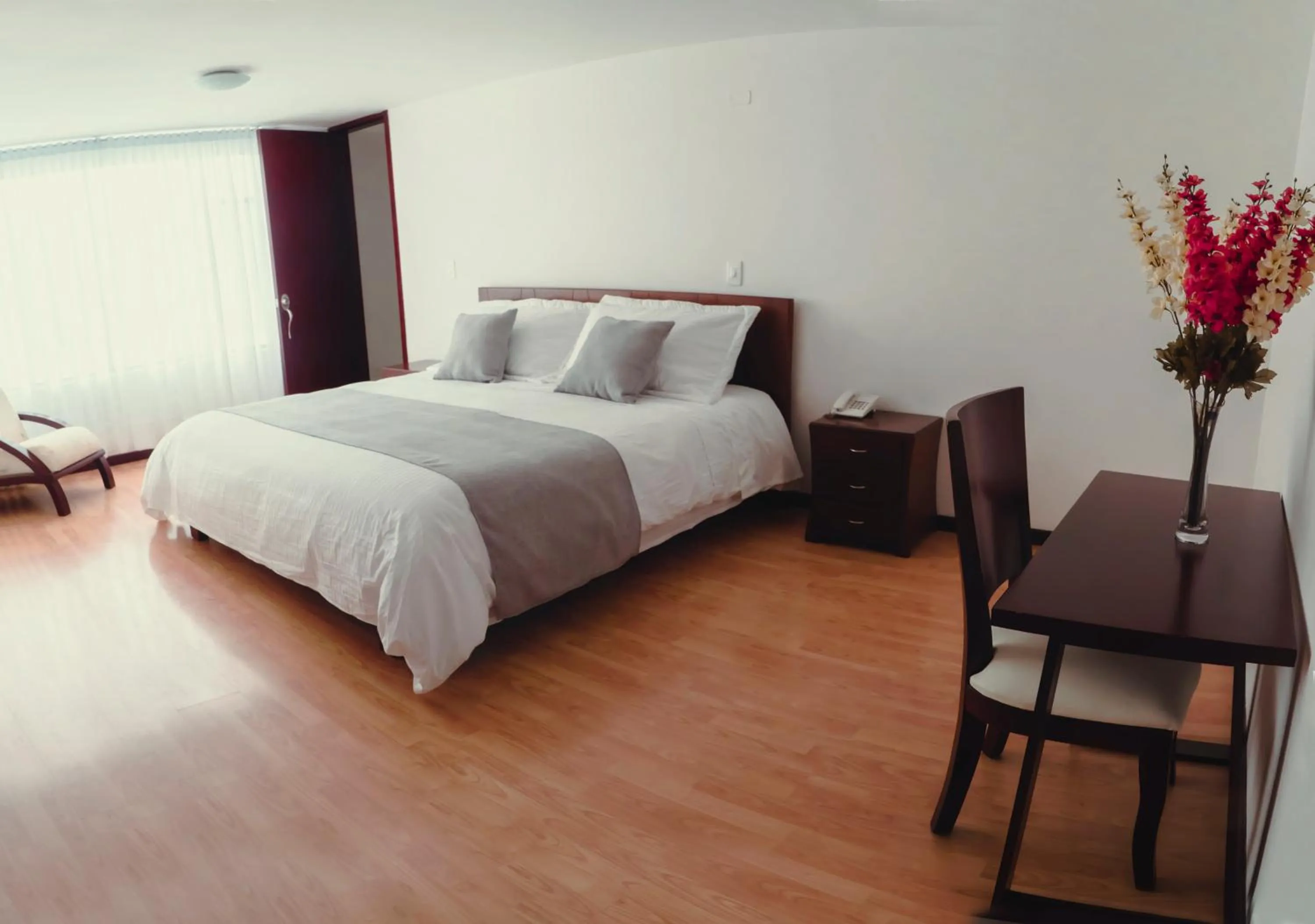 Photo of the whole room, Bed in Nogal Suite Hotel Pasto