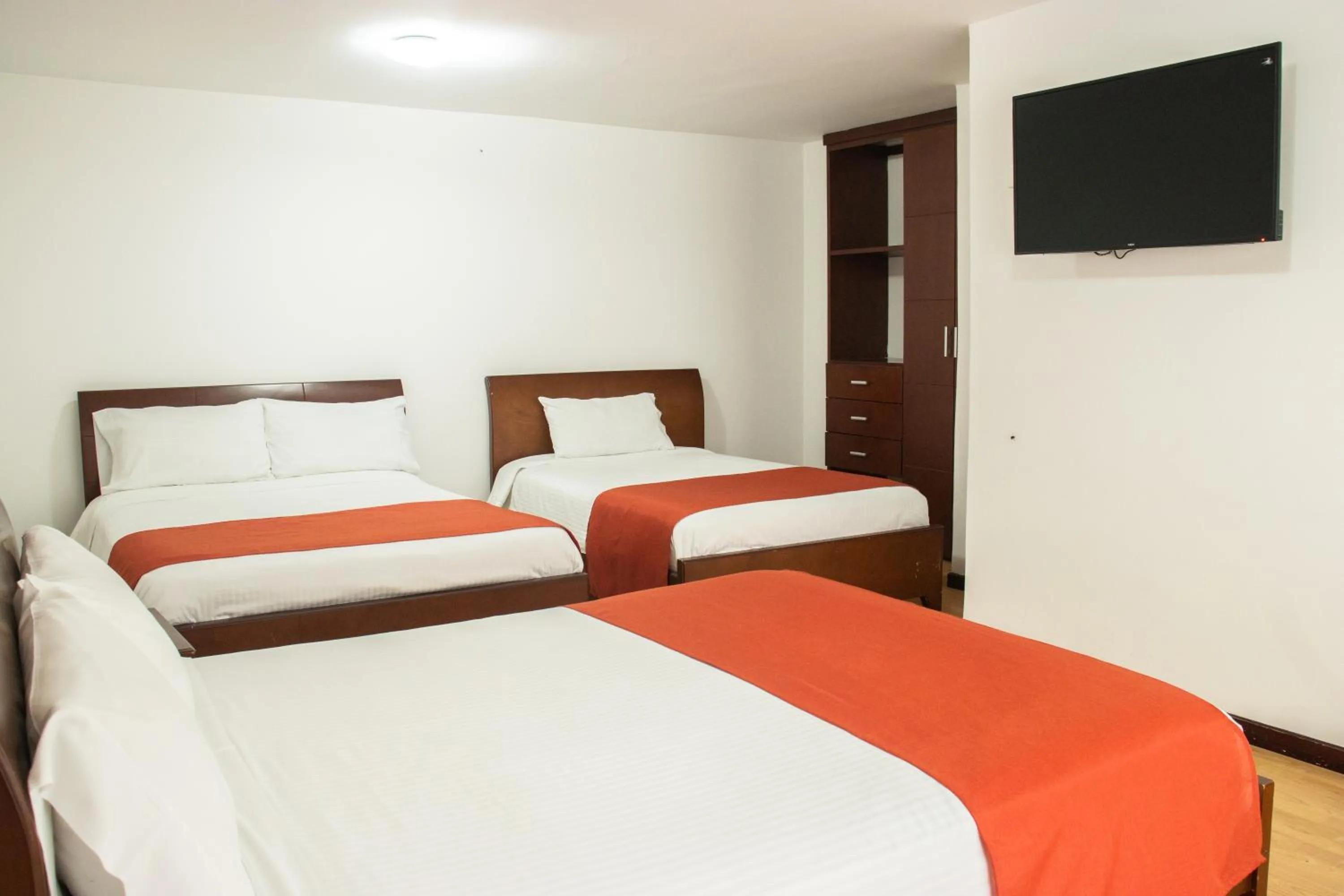 Photo of the whole room, Bed in Nogal Suite Hotel Pasto