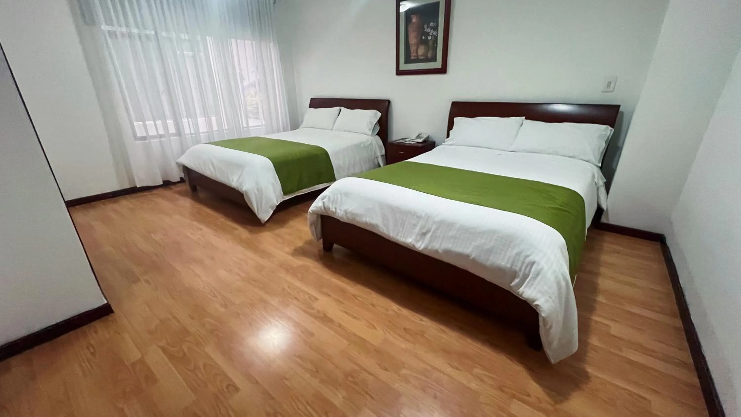 Bed in Nogal Suite Hotel Pasto