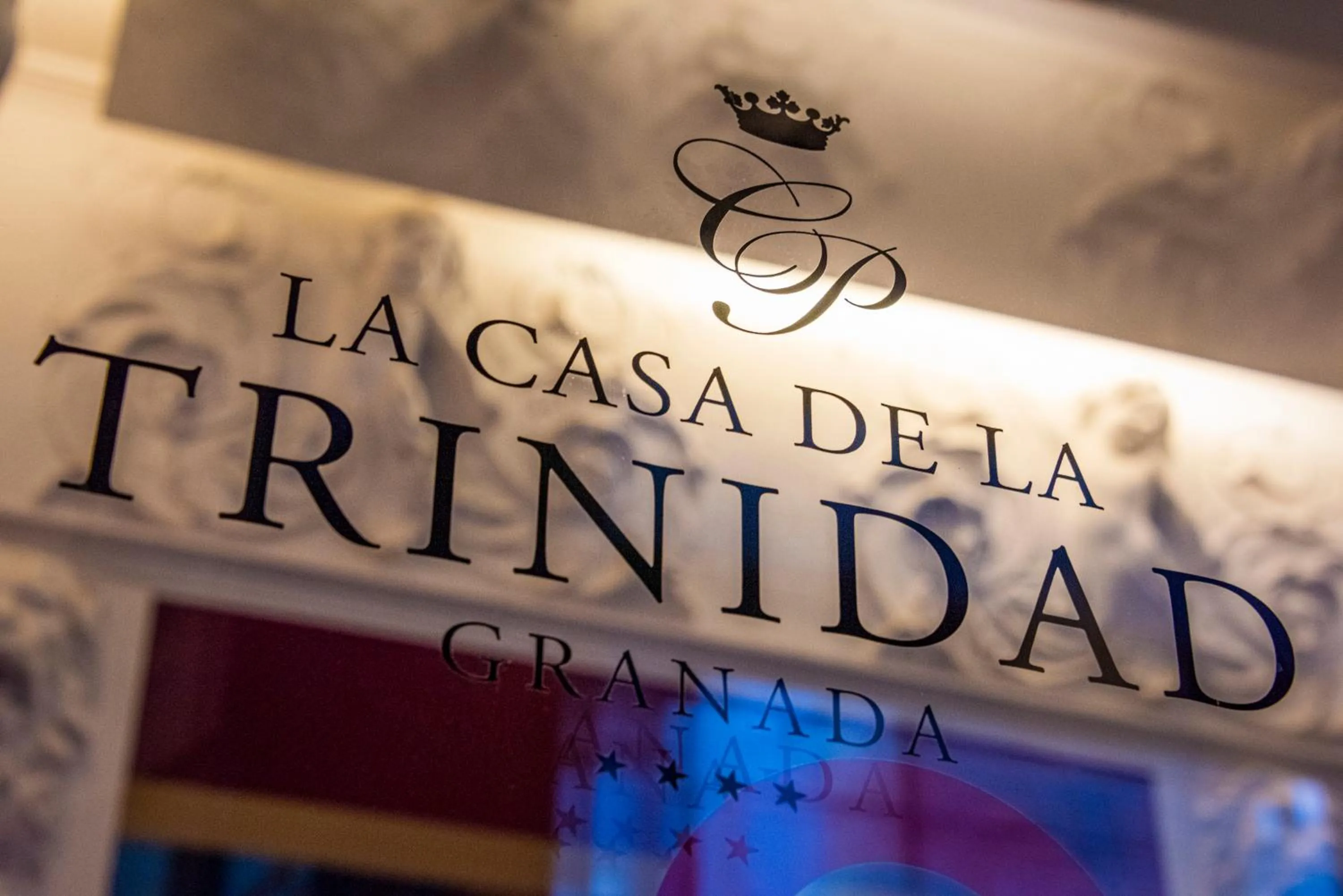 Property logo or sign in La Casa de la Trinidad