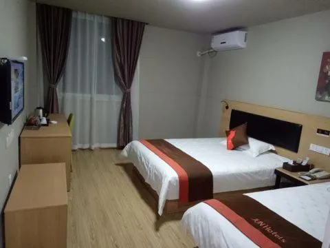 Bed in JUNYI Hotel Niongbo Xiangshan Bus Station