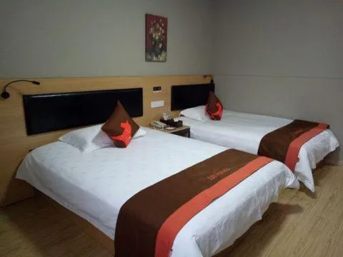 Bed in JUNYI Hotel Niongbo Xiangshan Bus Station