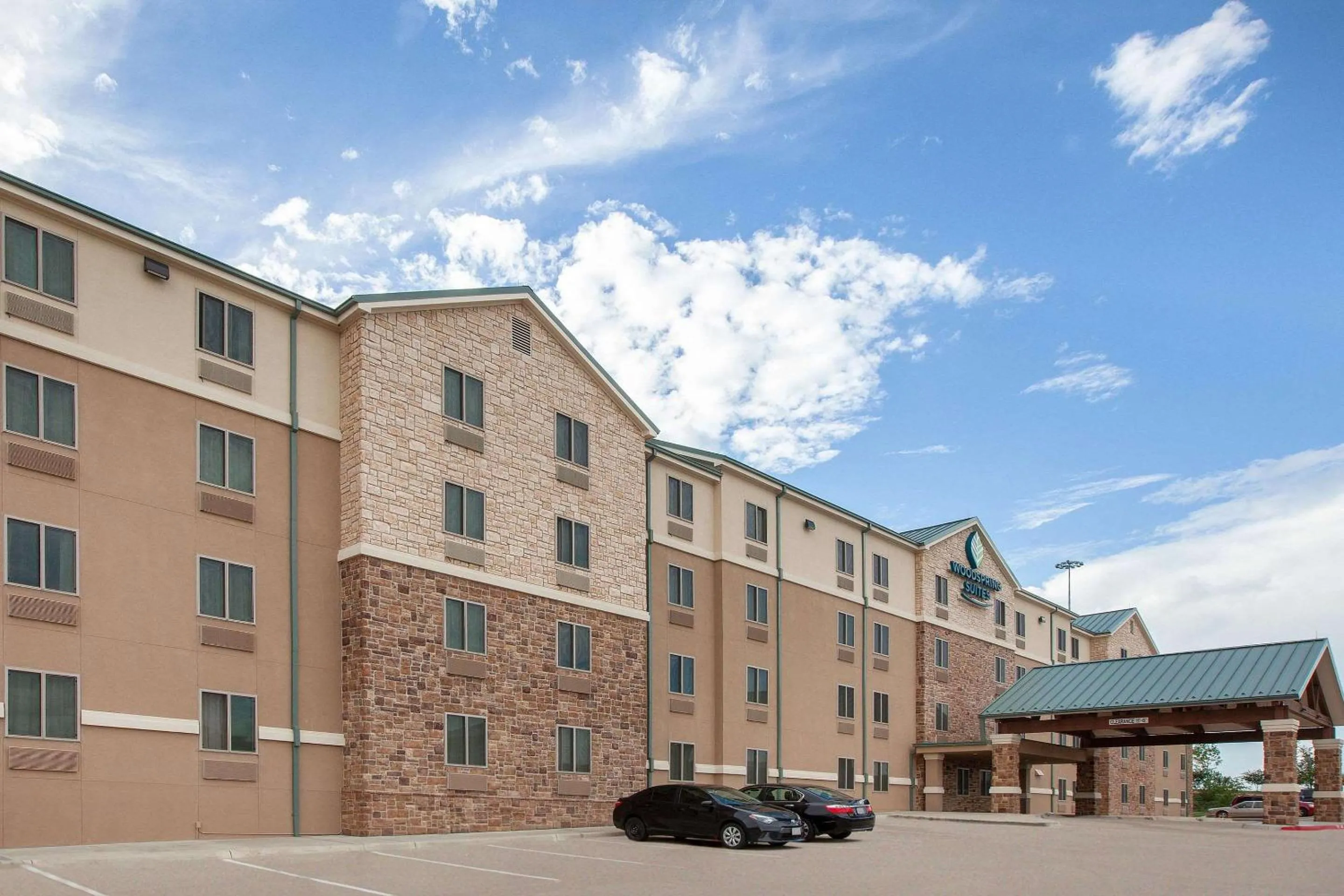 Property building in WoodSpring Suites Las Colinas - Northwest Dallas