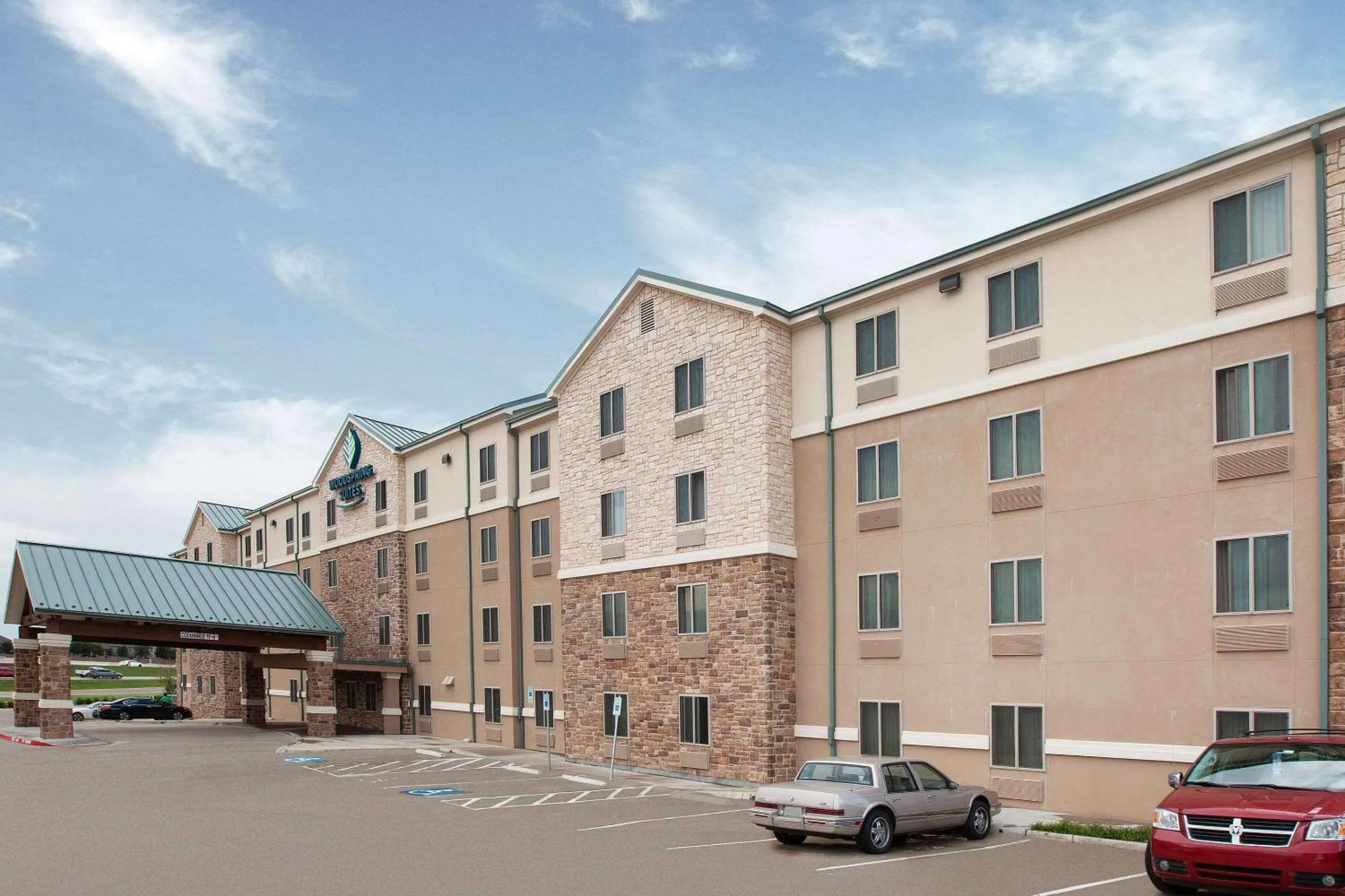 Property building in WoodSpring Suites Las Colinas - Northwest Dallas
