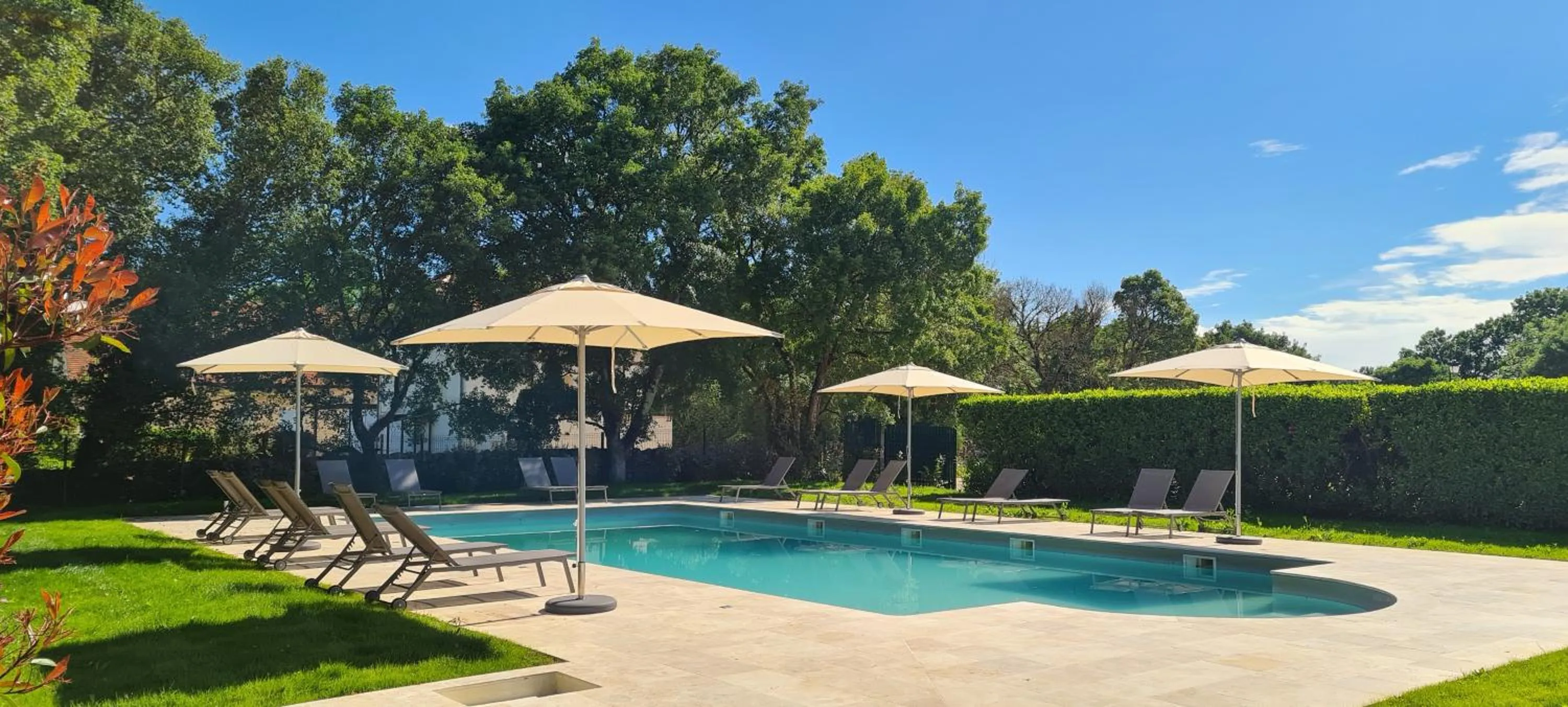 Swimming pool in Logis Hôtels - Le Bellaroc - Hôtel 2 étoiles et Restaurant