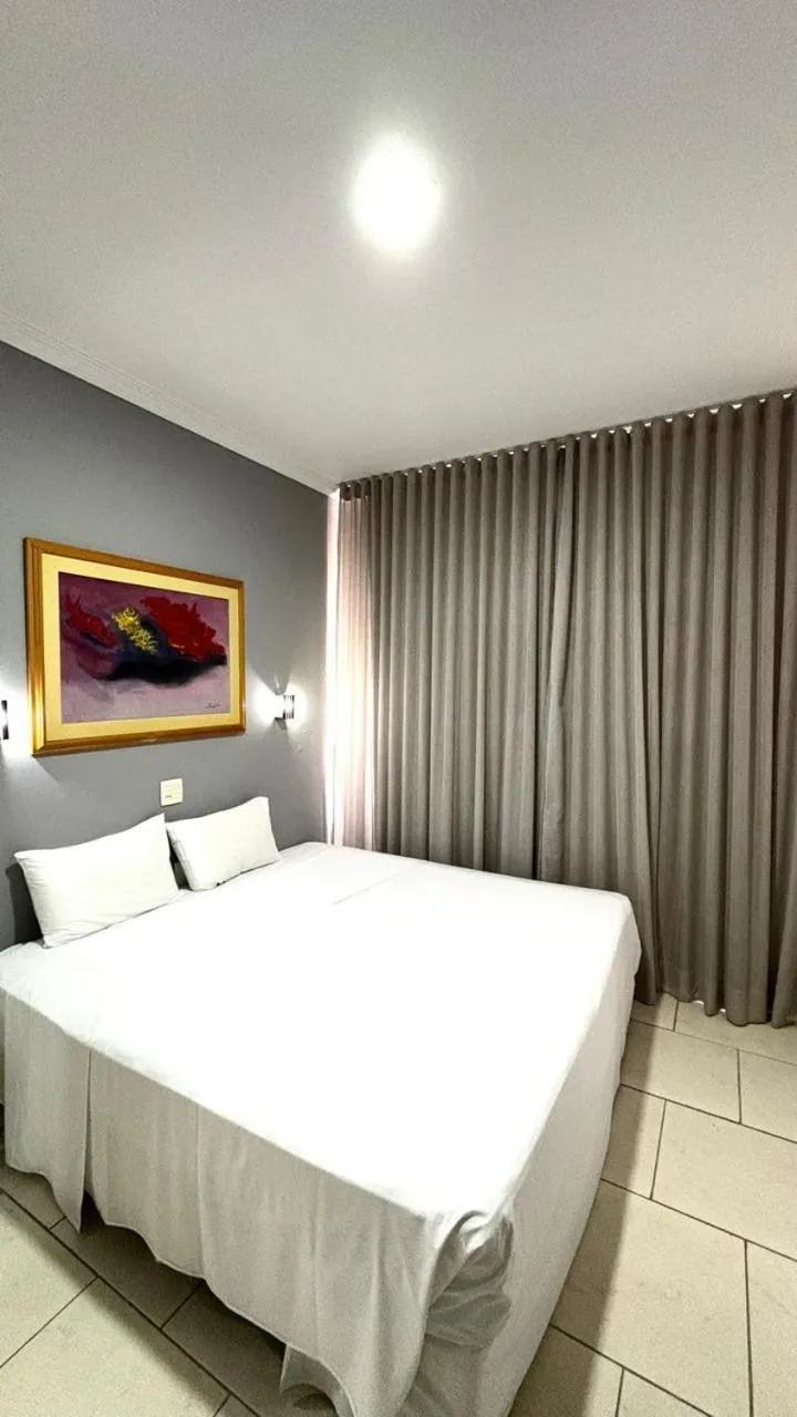 Bed in HOTEL DEL REY CURITIBA by POTY - NA FAMOSA RUA XV DE NOVEMBRO