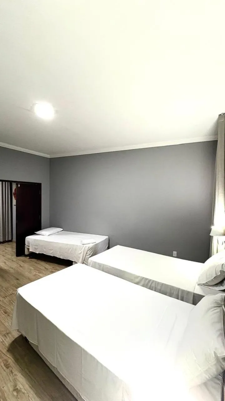 Bed in HOTEL DEL REY CURITIBA by POTY - NA FAMOSA RUA XV DE NOVEMBRO