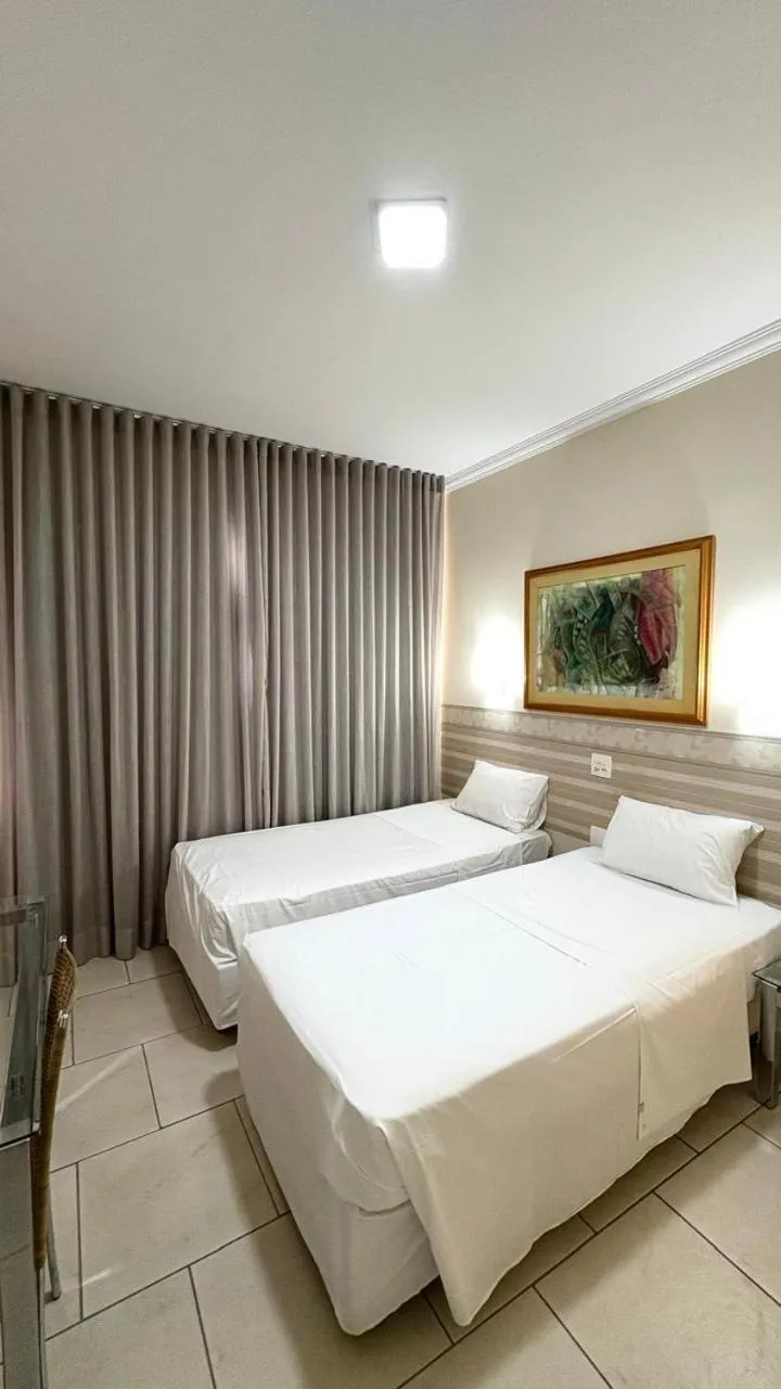 Bed in HOTEL DEL REY CURITIBA by POTY - NA FAMOSA RUA XV DE NOVEMBRO