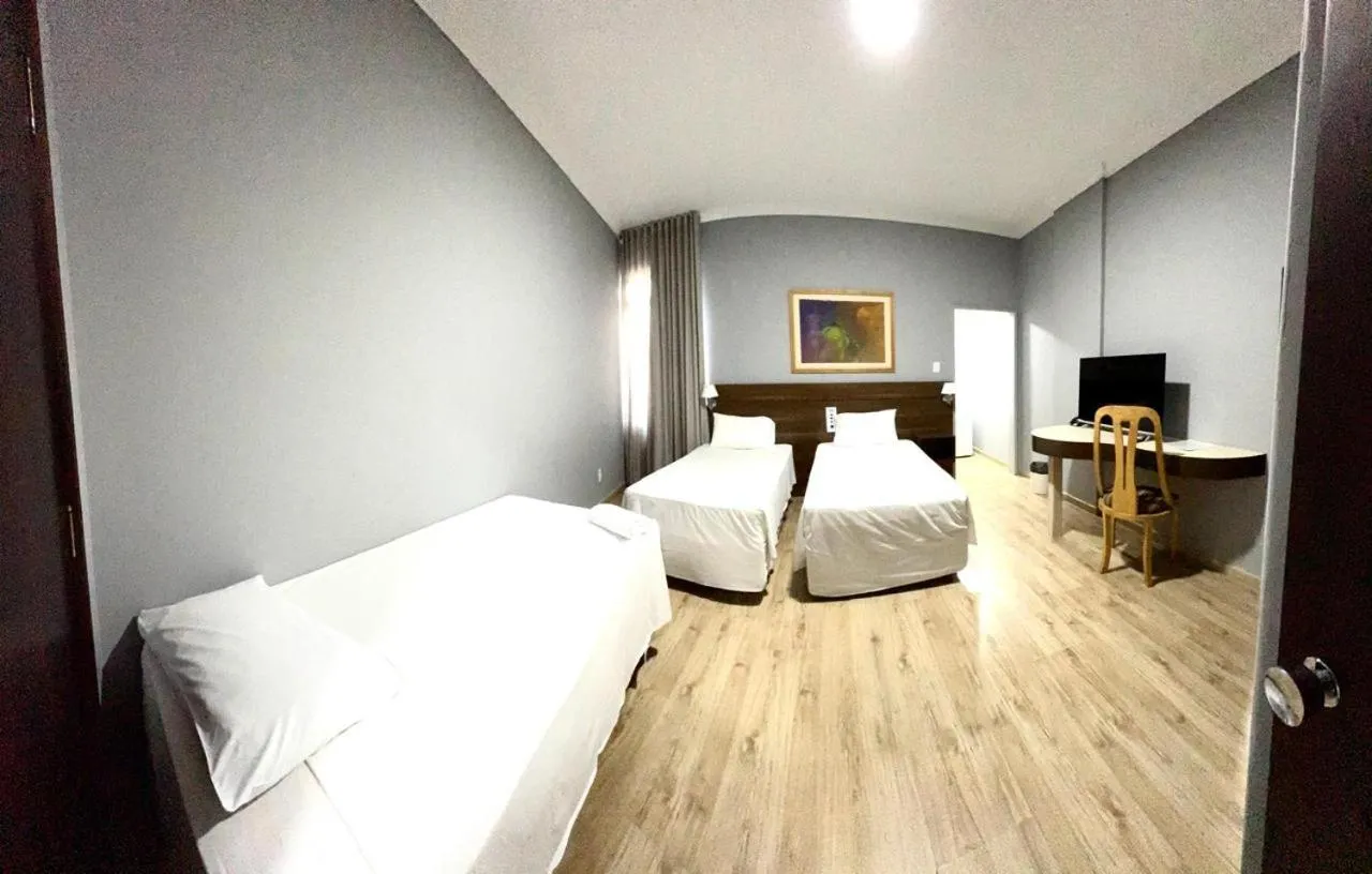 Bed in HOTEL DEL REY CURITIBA by POTY - NA FAMOSA RUA XV DE NOVEMBRO