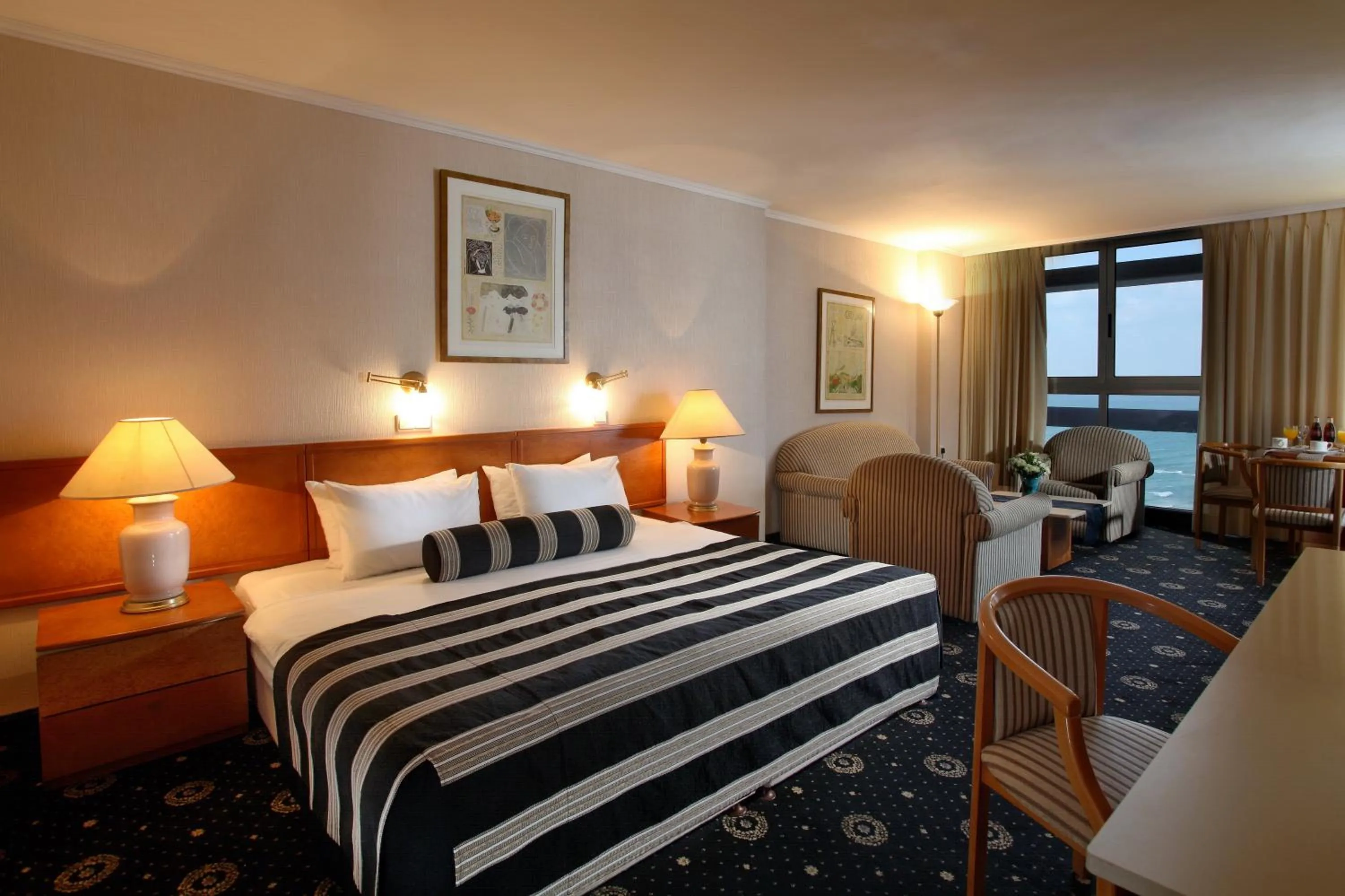 Bed in The Seasons Hotel -Studio & Suite