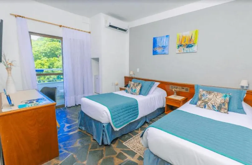 Bed in Hotel Villareal São Francisco do Sul