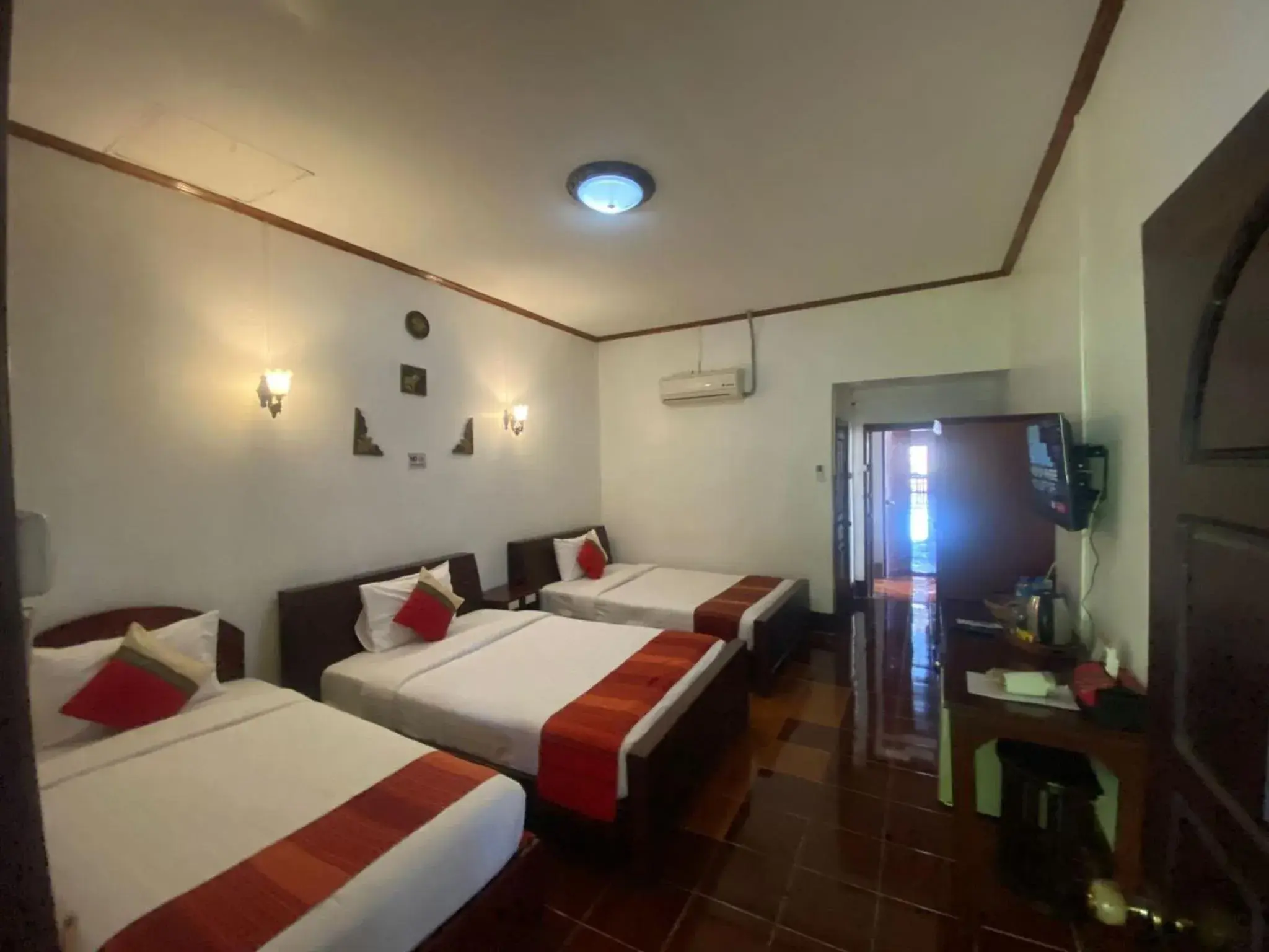 Triple Room with Pool View in Vangsavath Hotel Triple Room with Pool View in Vangsavath Hotel