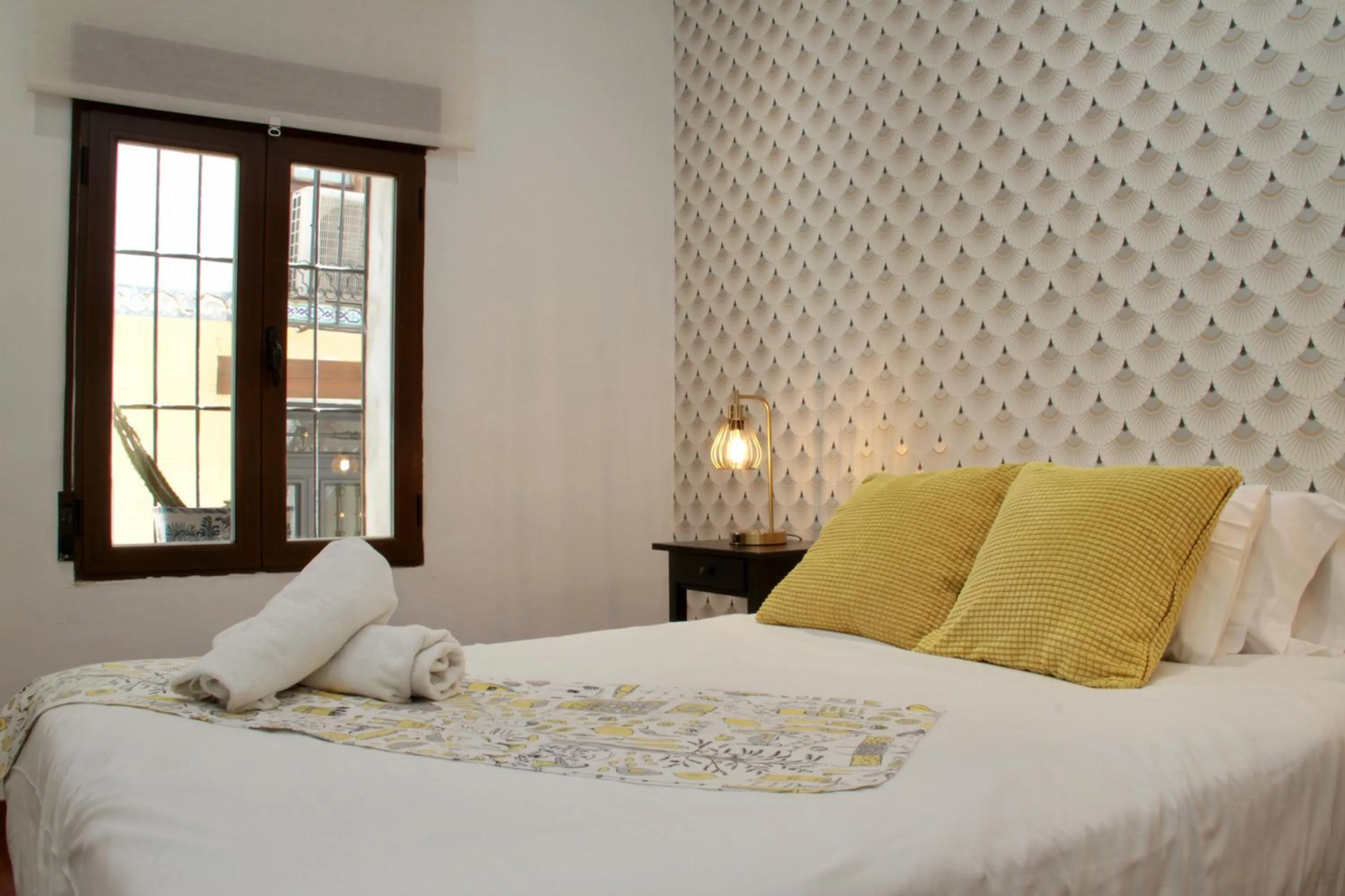 Bedroom, Bed in Apartamentos Inside Paseo de los Tristes