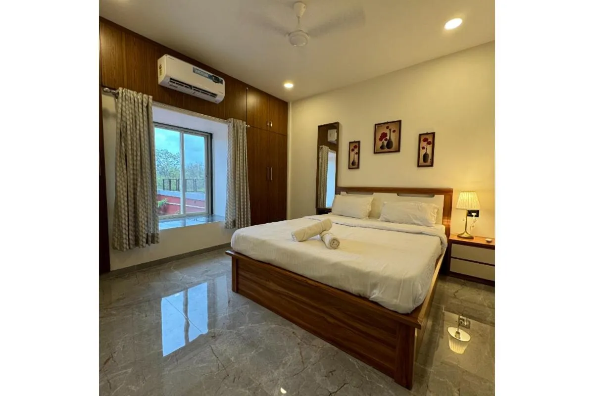 Bed in Hotel Sadhana Executive