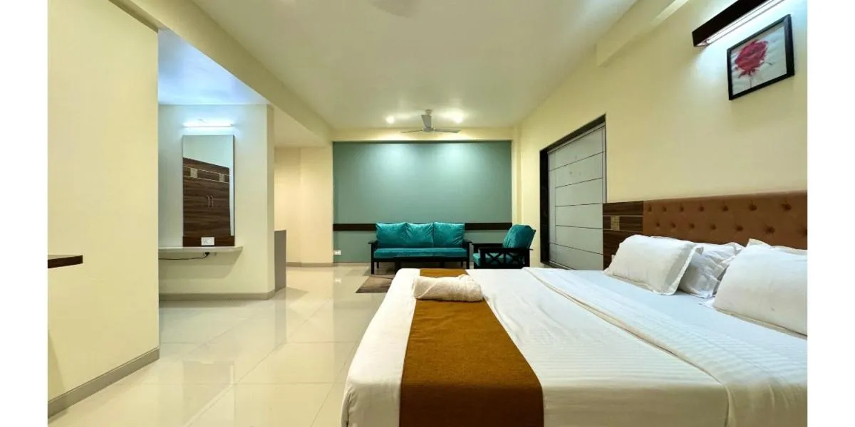 Bed in Hotel Sadhana Executive
