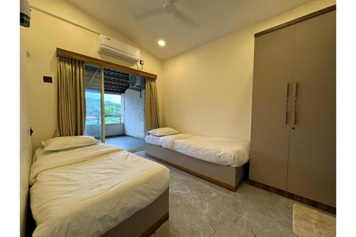 Bed in Hotel Sadhana Executive