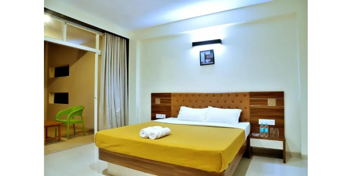 Bed in Hotel Sadhana Executive