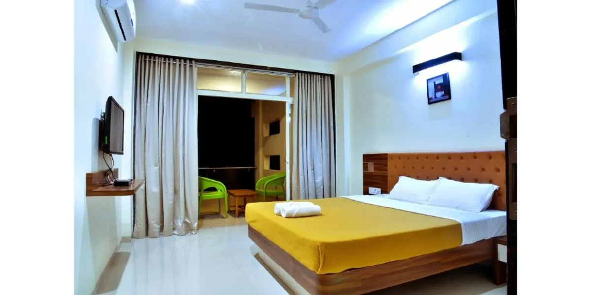 Bed in Hotel Sadhana Executive