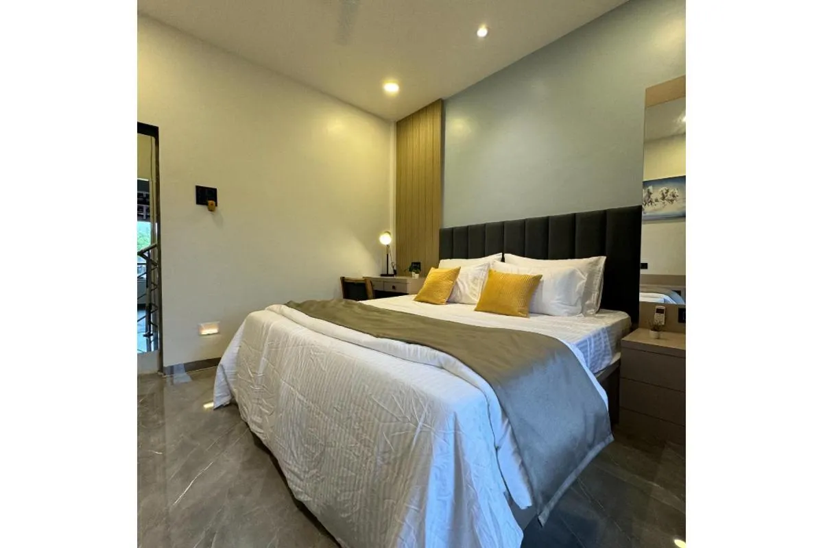 Bed in Hotel Sadhana Executive