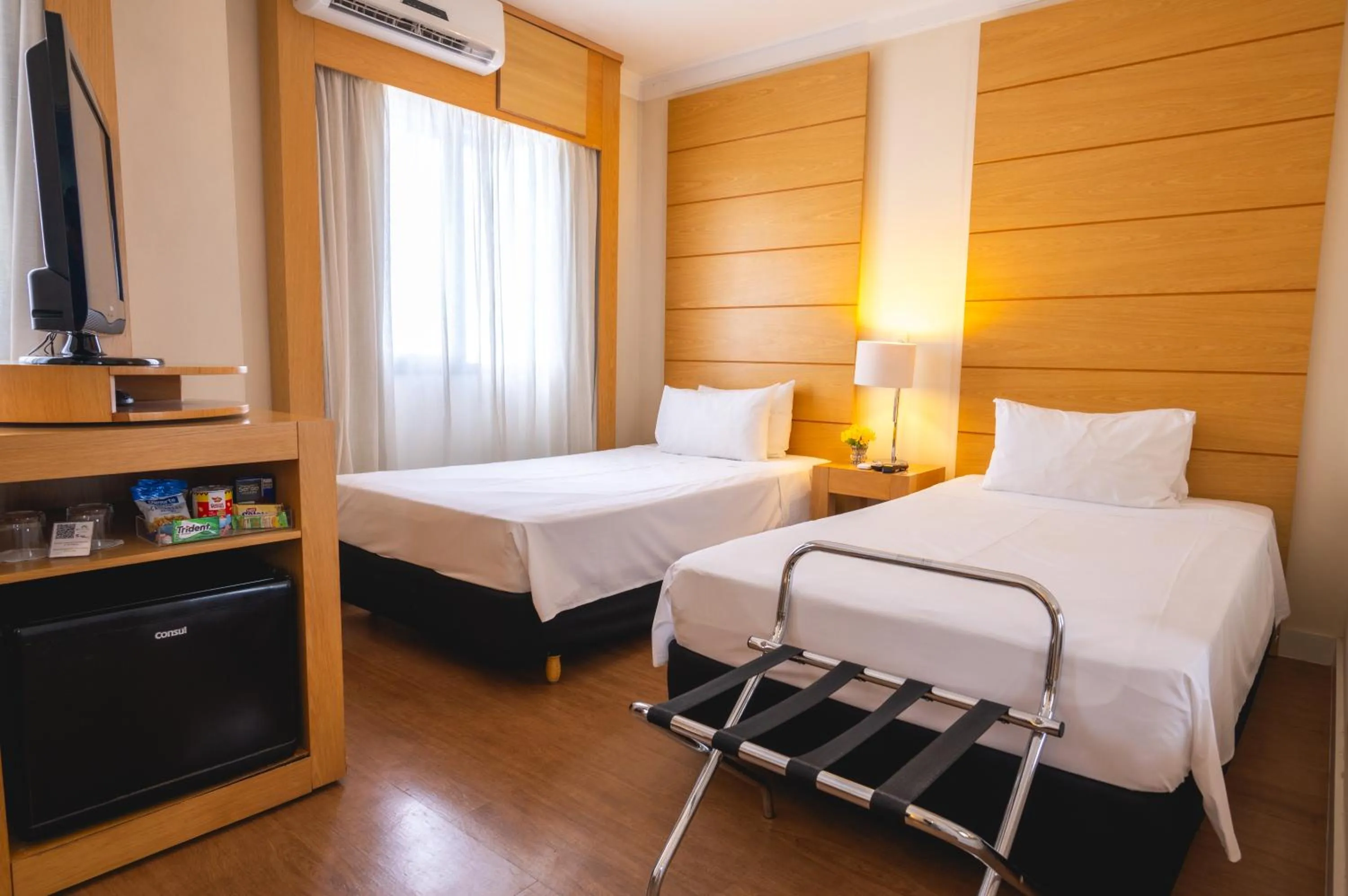 Bed in eSuítes Congonhas by Atlantica