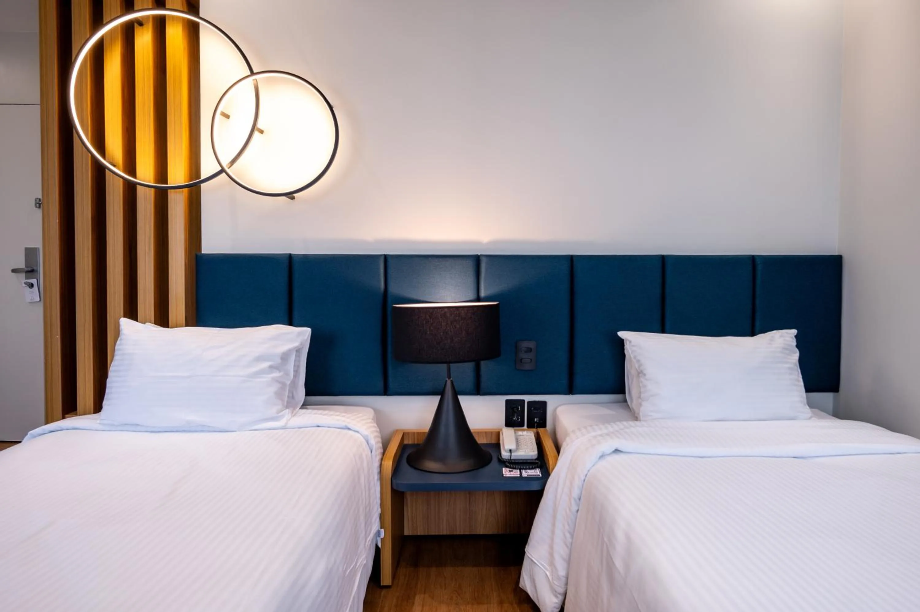 Bed in eSuítes Congonhas by Atlantica