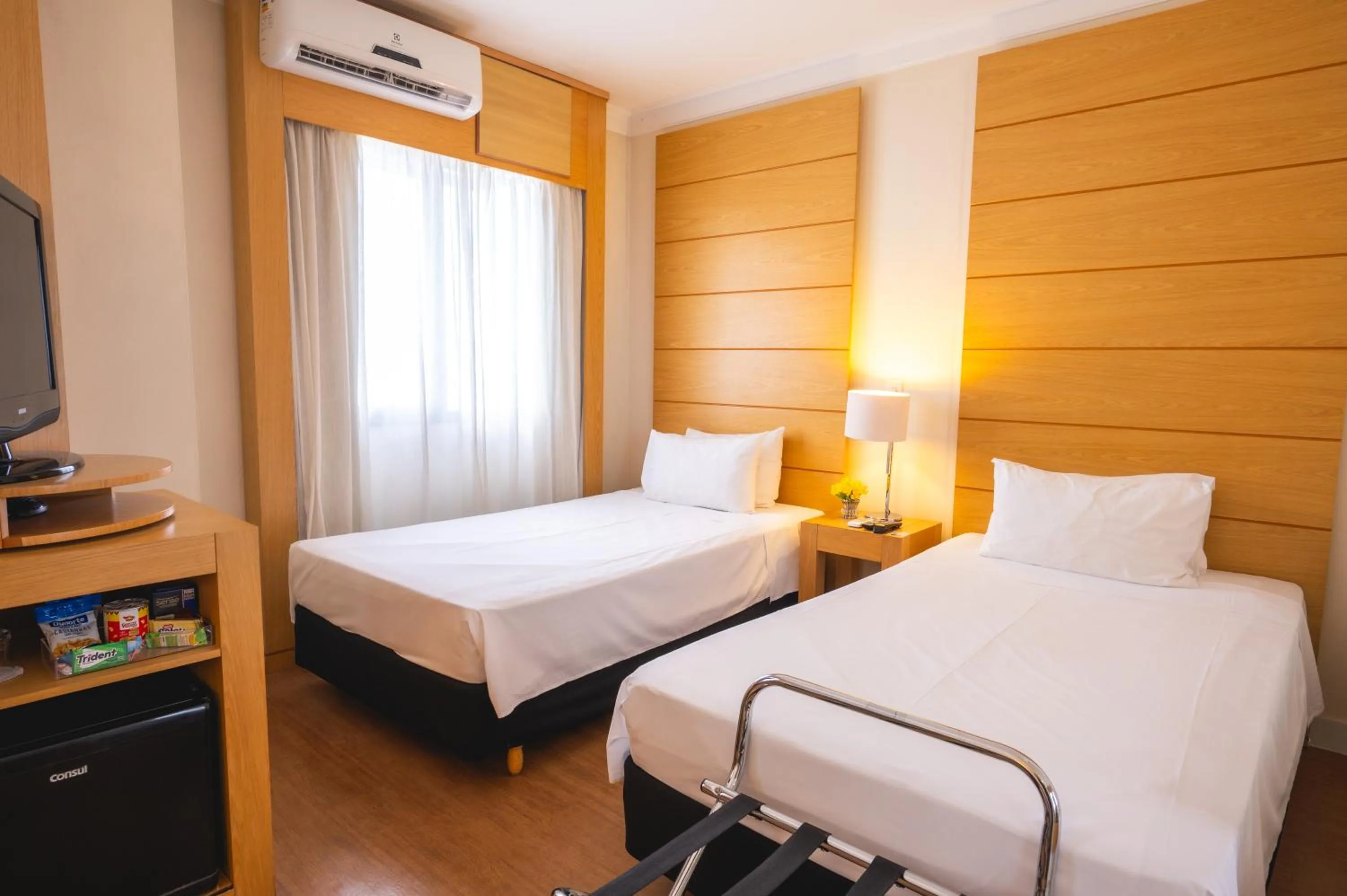 Bed in eSuítes Congonhas by Atlantica