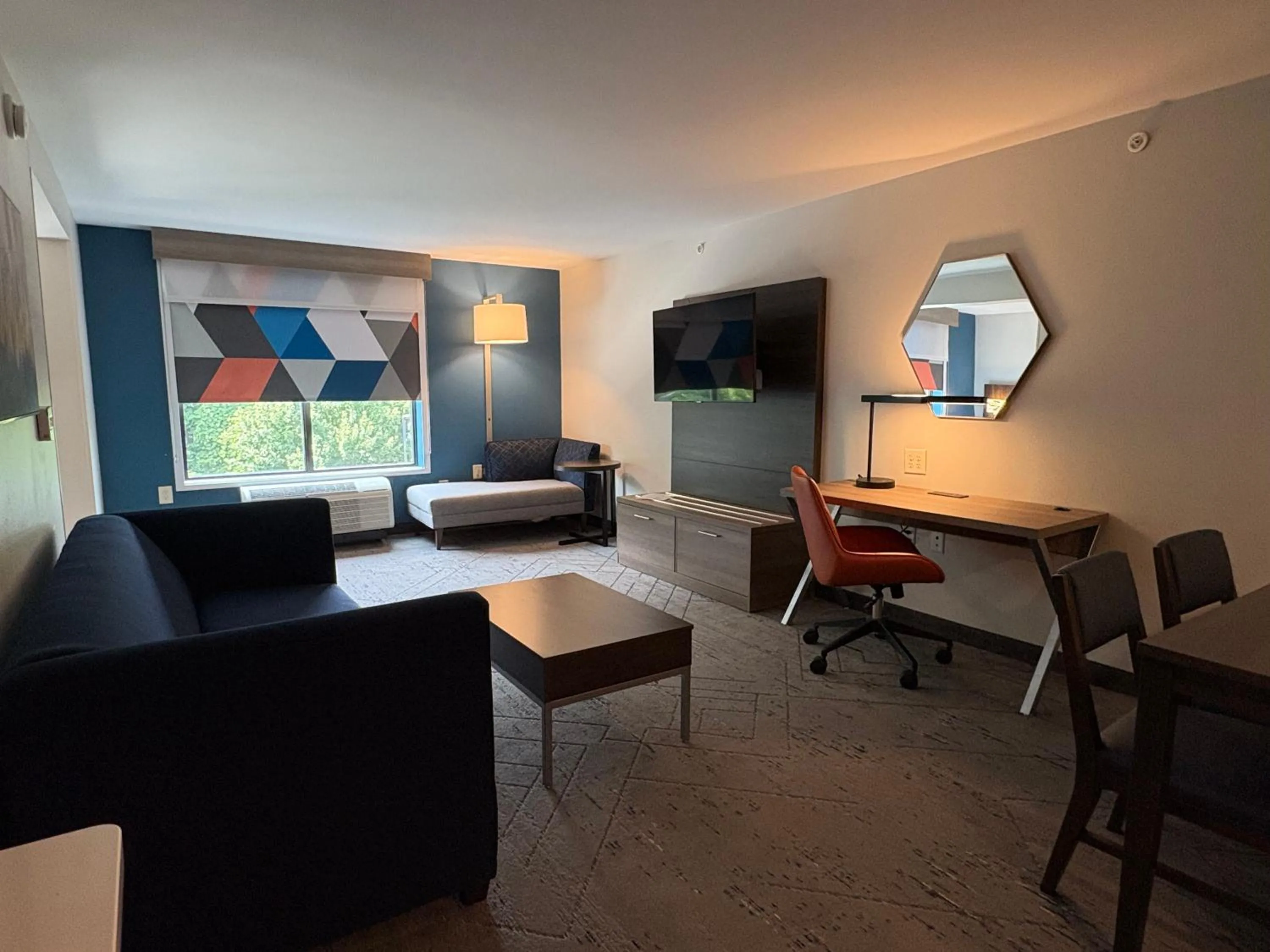 Living room in Holiday Inn Express & Suites Raleigh West - Lenovo Center by IHG