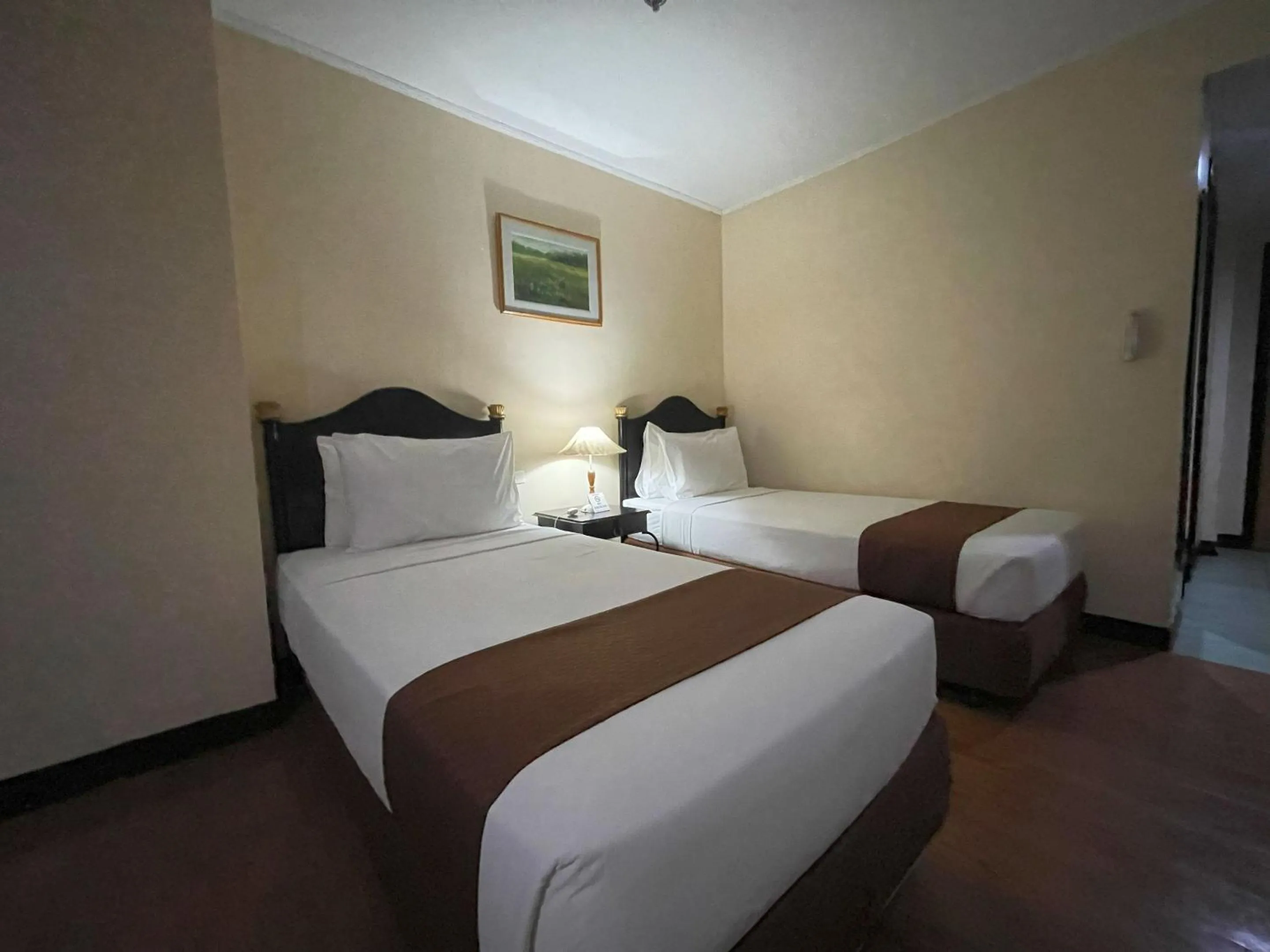 Bed in Golden Peak Hotel & Suites powered by Cocotel