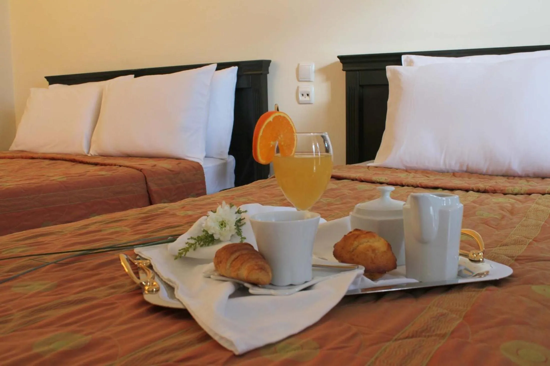 Bed in Famissi Eden Hotel