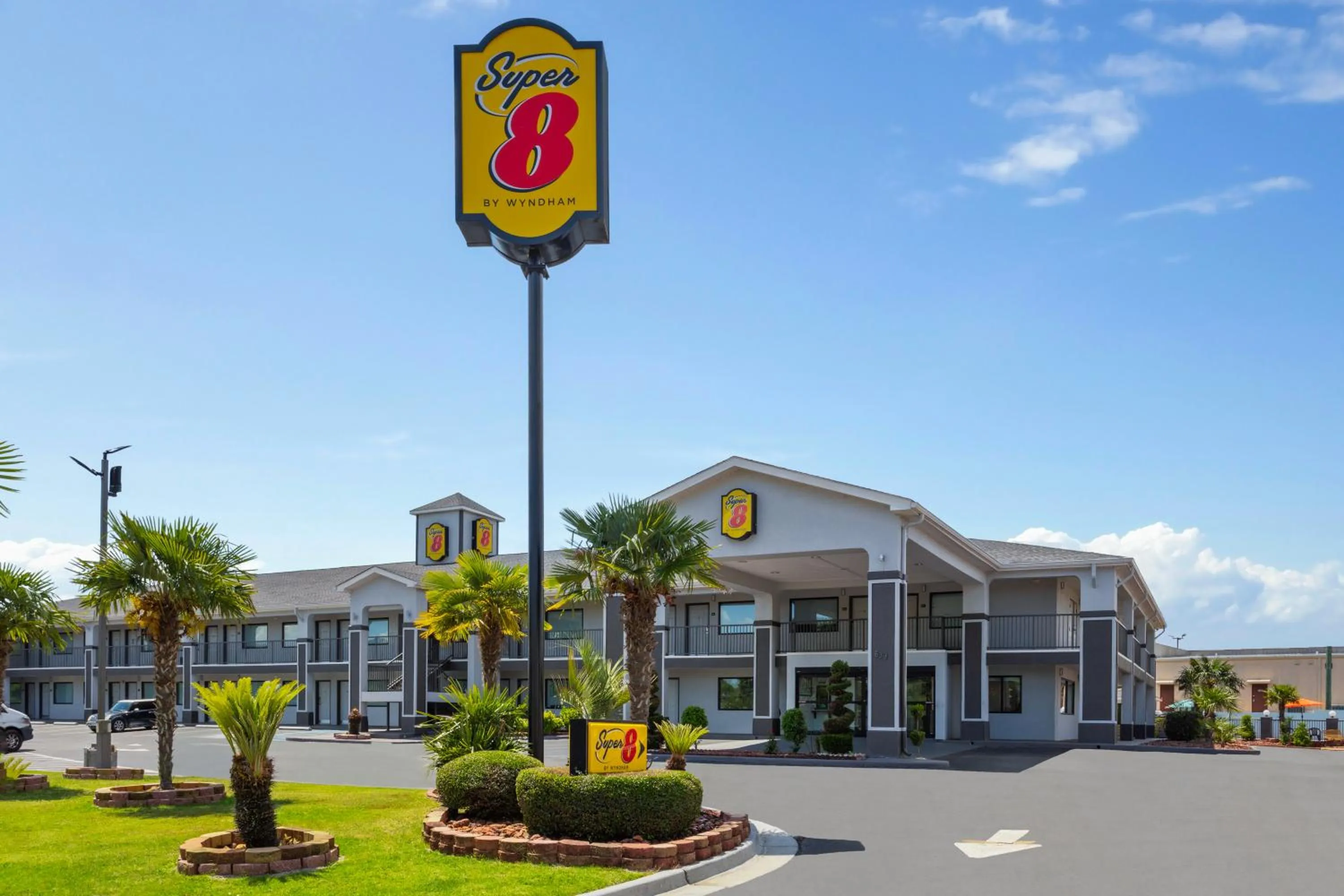 Property logo or sign in Super 8 by Wyndham Prattville Montgomery