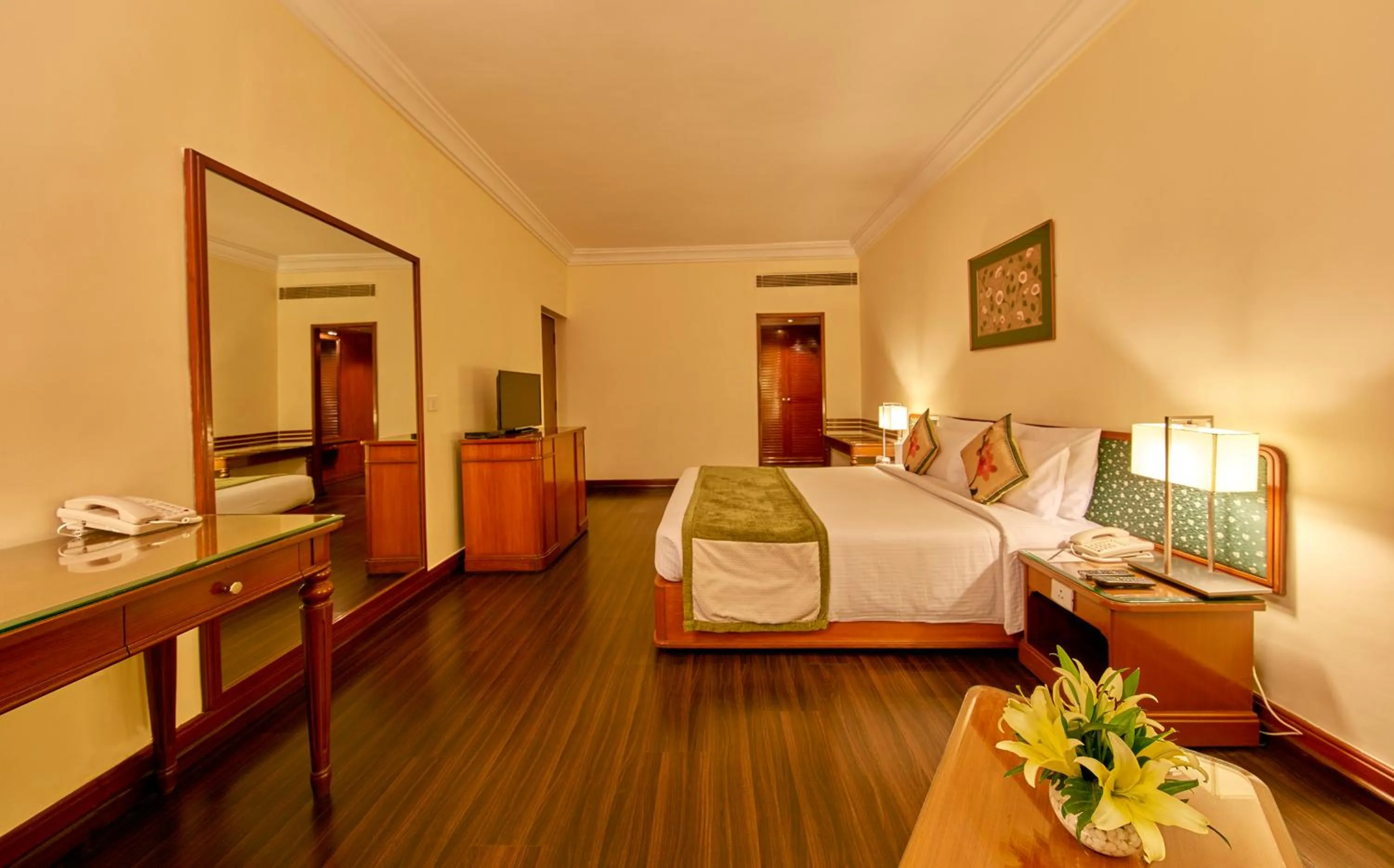 Bedroom, Bed in Royal Orchid Central Bangalore, MG Road