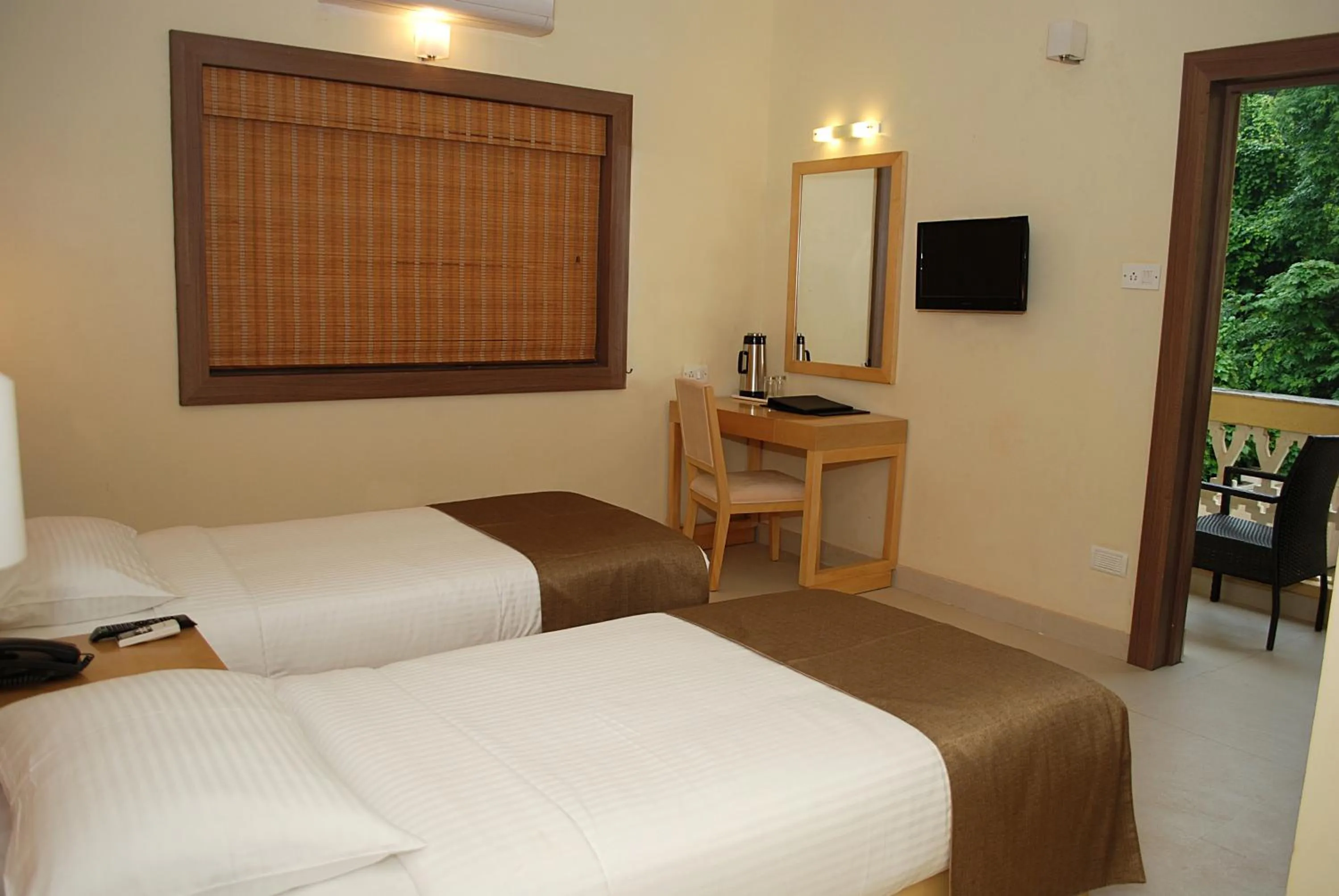 Bed in Sandalwood Hotel & Suites