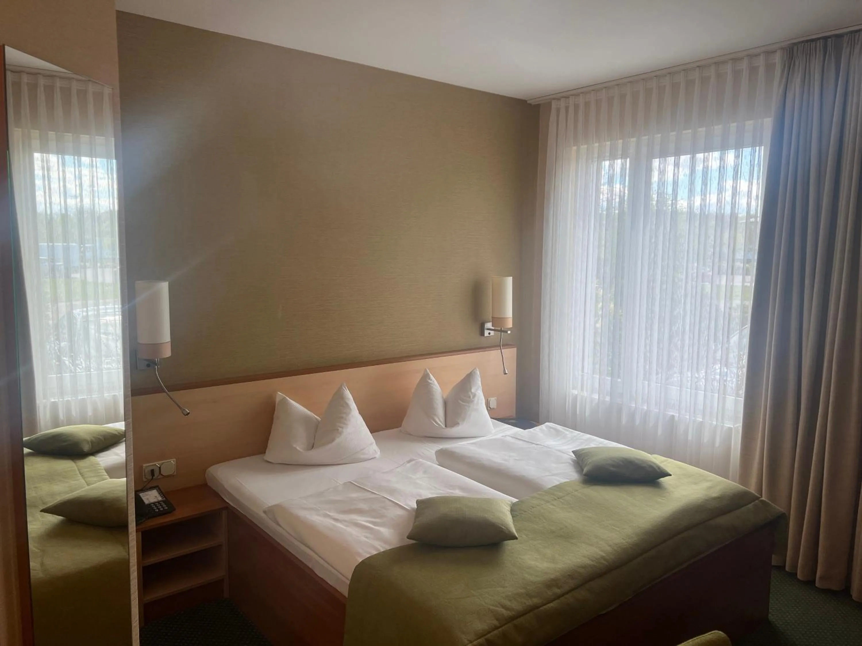 Photo of the whole room, Bed in Atrium Hotel Krüger