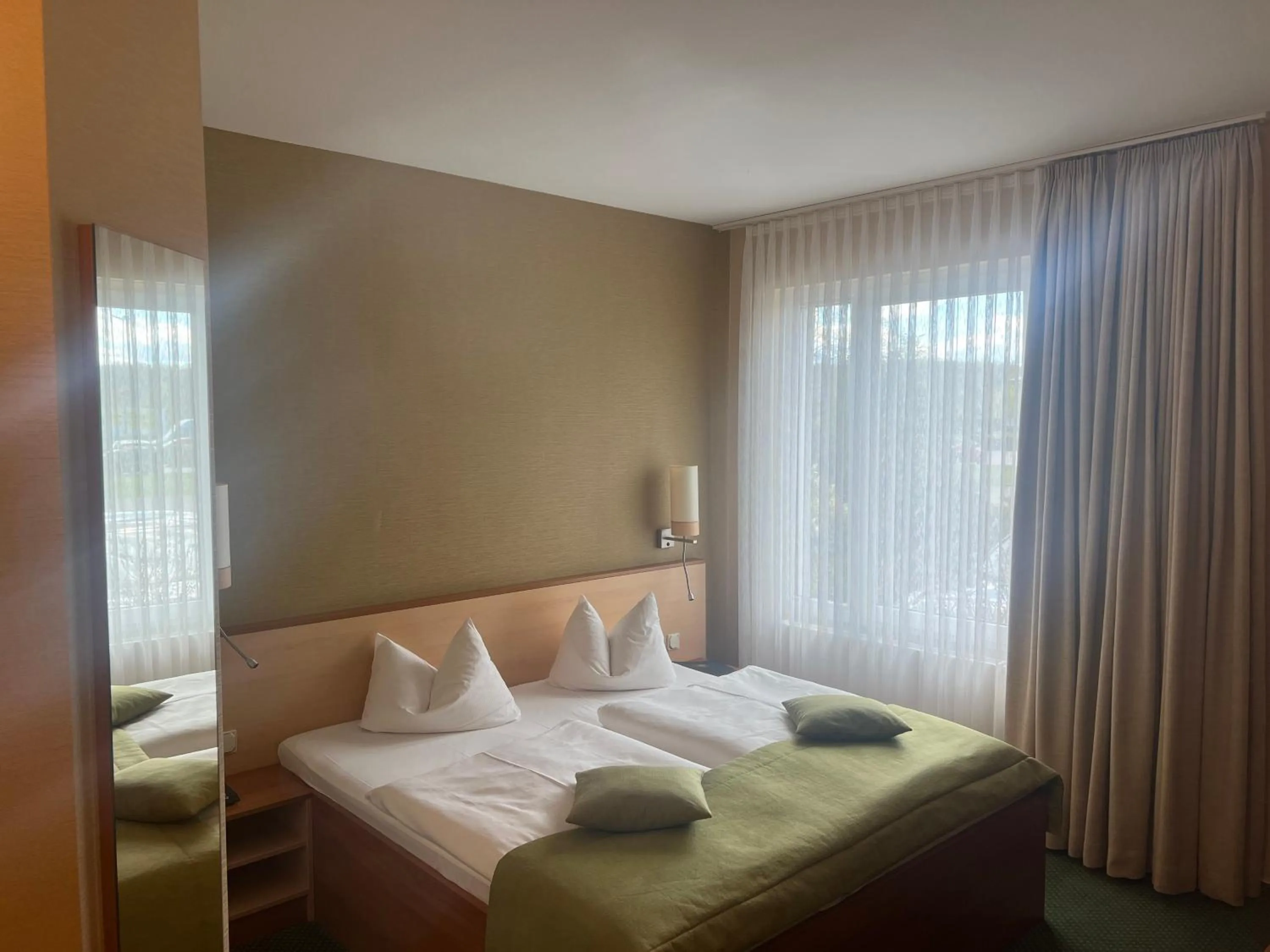 Photo of the whole room, Bed in Atrium Hotel Krüger